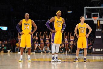 LOS ANGELES, CA - JANUARY 17: Kobe Bryant #24, Dwight Howard #12, and Steve Nash #10 of the Los Angeles Lakers look on against the Miami Heat at Staples Center on January 15, 2013 in Los Angeles, California. NOTE TO USER: User expressly acknowledges and a