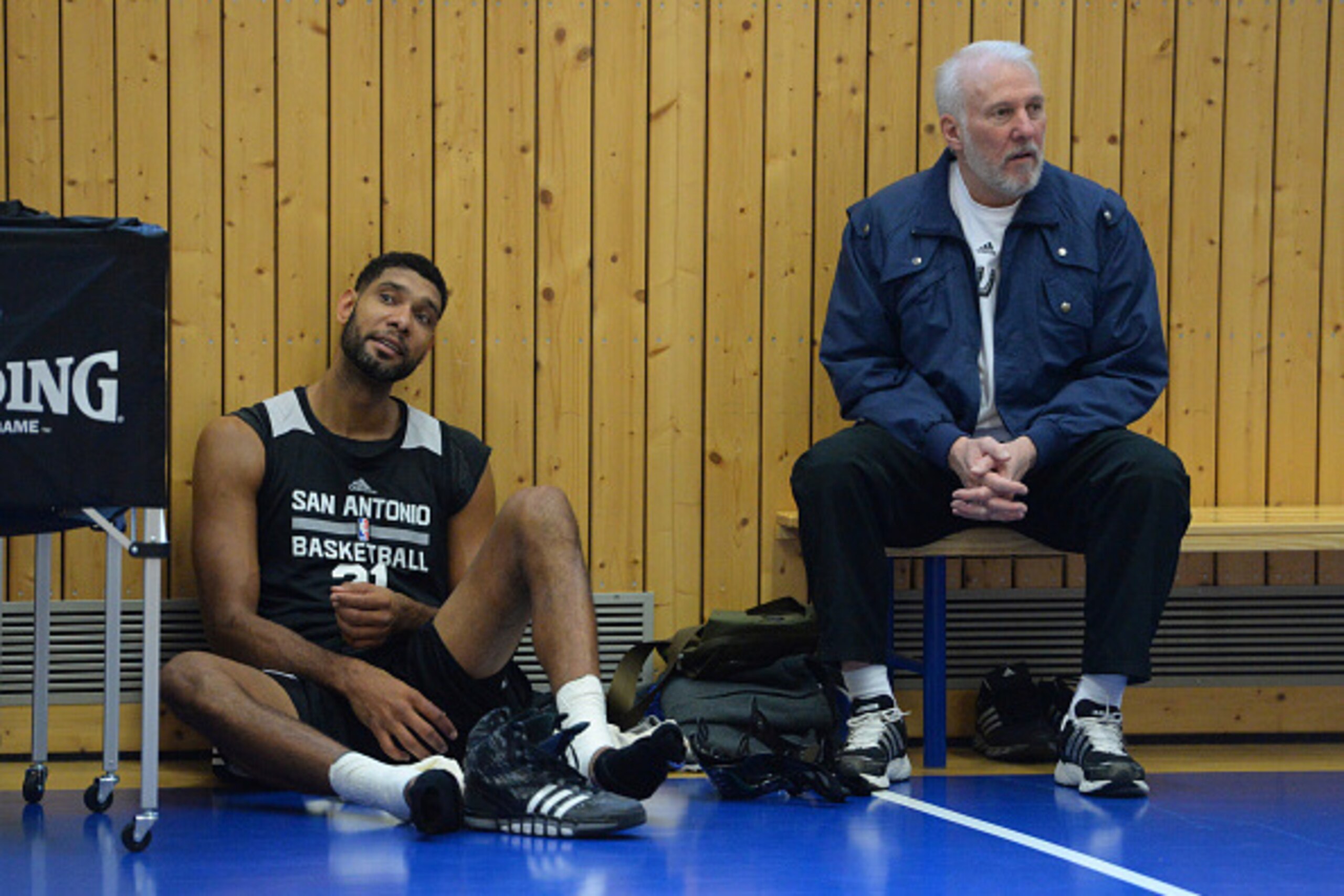BERLIN - OCTOBER 5: Head Coach Gregg Popovich and Tim Duncan #21 of the San Antonio Spurs talk during practice as part of the 2014 Global Games on October 5, 2014 at the Alba practice facility in Berlin, Germany. NOTE TO USER: User expressly acknowledges 