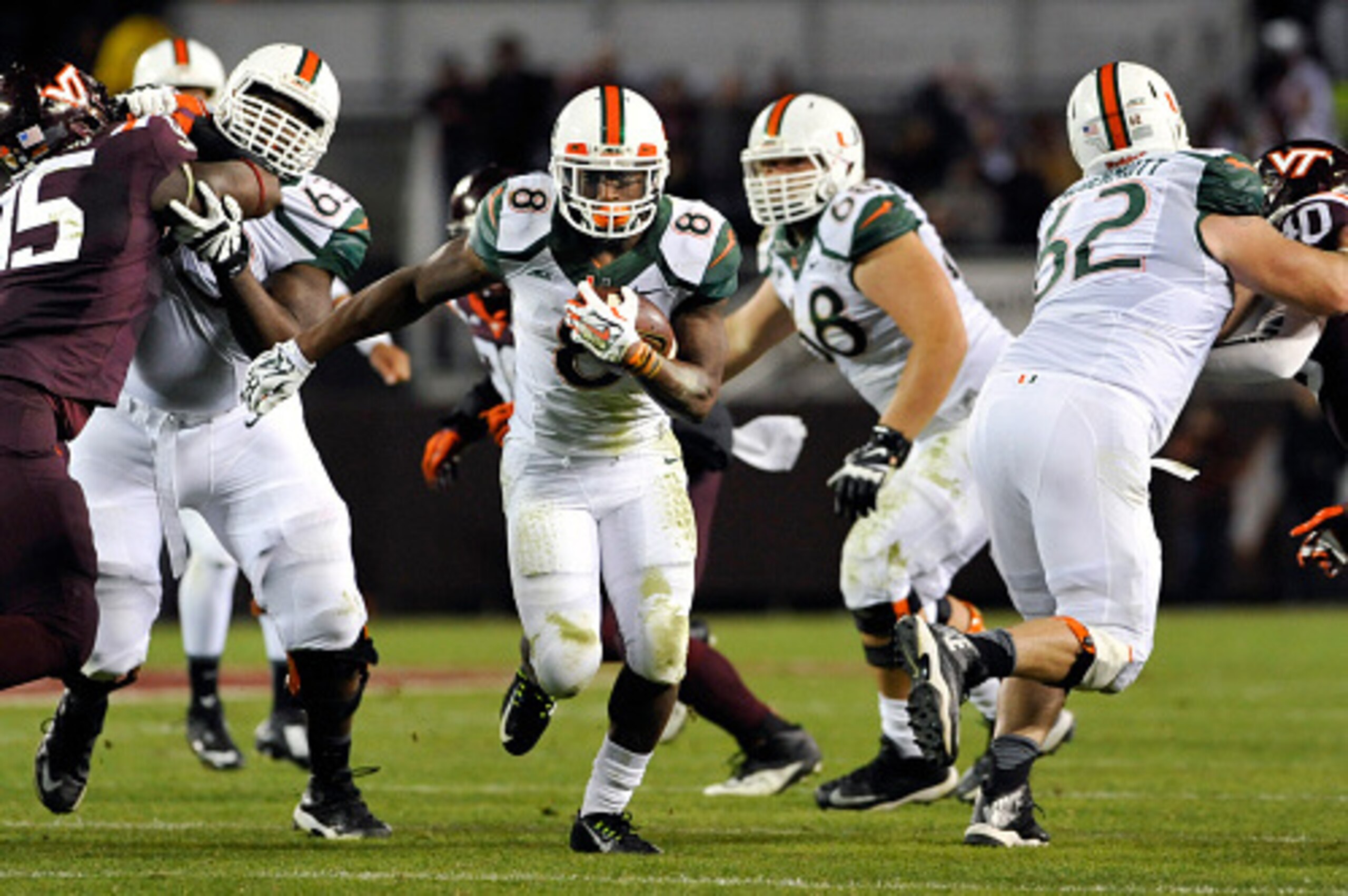 BLACKSBURG, VA - OCTOBER 23: Running back Duke Johnson #8 of the Miami Hurricanes breaks through a large hole to score the second touchdown of the game against the Virginia Tech Hokies in the first half at Lane Stadium on October 23, 2014 in Blacksburg, V
