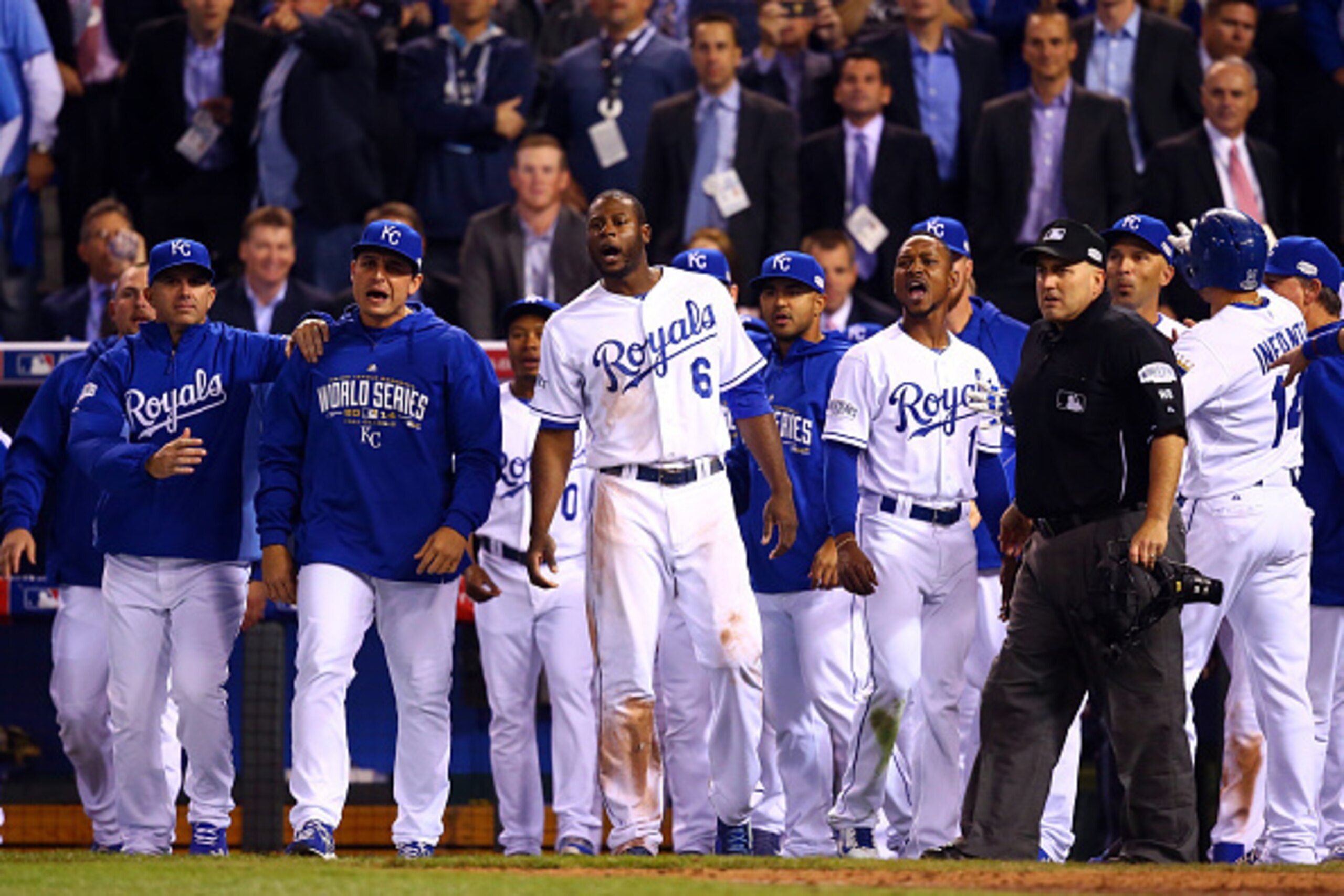 KANSAS CITY, MO - OCTOBER 22:  The Kansas City Royals bench comes to the field after words were exchanged between Salvador Perez #13 and Hunter Strickland #60 of the San Francisco Giants during Game Two of the 2014 World Series at Kauffman Stadium on Octo