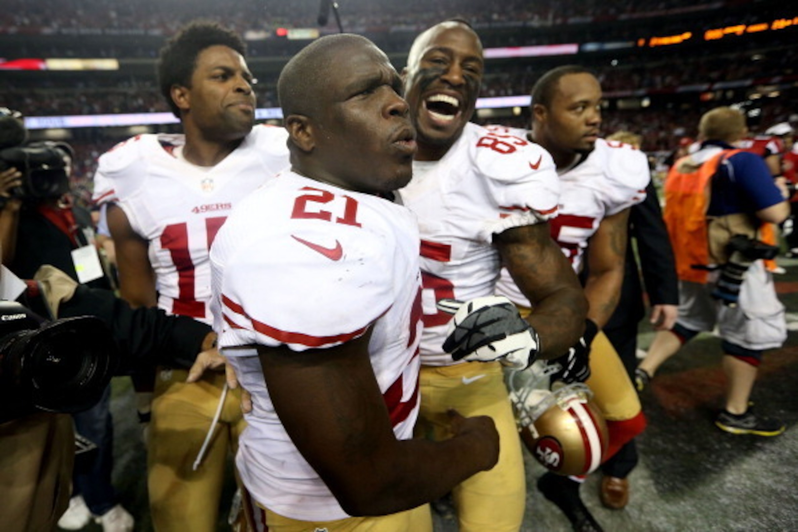 ATLANTA, GA - JANUARY 20:  Wide receiver Michael Crabtree #15, running back Frank Gore #21 and tight end Vernon Davis #85 of the San Francisco 49ers celebrate after the 49ers defeated the Atlanta Falcons 28-24 in the NFC Championship game at the Georgia D