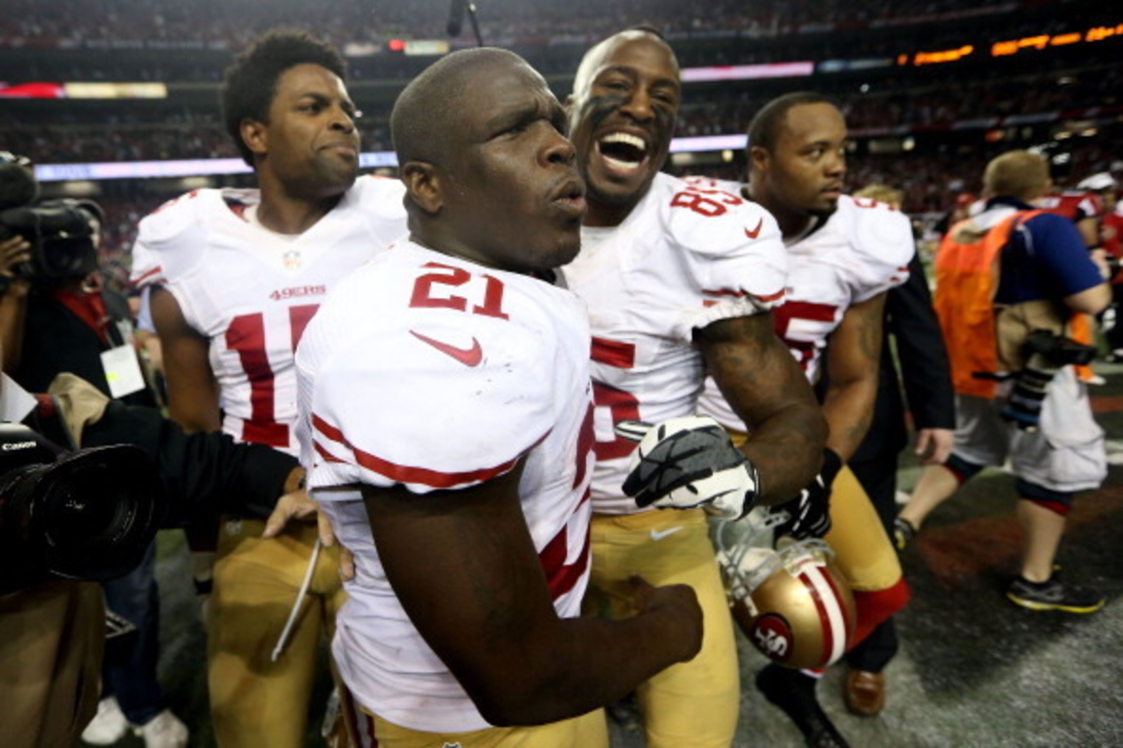 ATLANTA, GA - JANUARY 20:  Wide receiver Michael Crabtree #15, running back Frank Gore #21 and tight end Vernon Davis #85 of the San Francisco 49ers celebrate after the 49ers defeated the Atlanta Falcons 28-24 in the NFC Championship game at the Georgia D