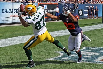 CHICAGO, IL - SEPTEMBER 28:  Jordy Nelson #87 of the Green Bay Packers catches a touchdown pass in front of  Kyle Fuller #23 of the Chicago Bears during the second quarter at Soldier Field on September 28, 2014 in Chicago, Illinois. (Photo by Jonathan Dan