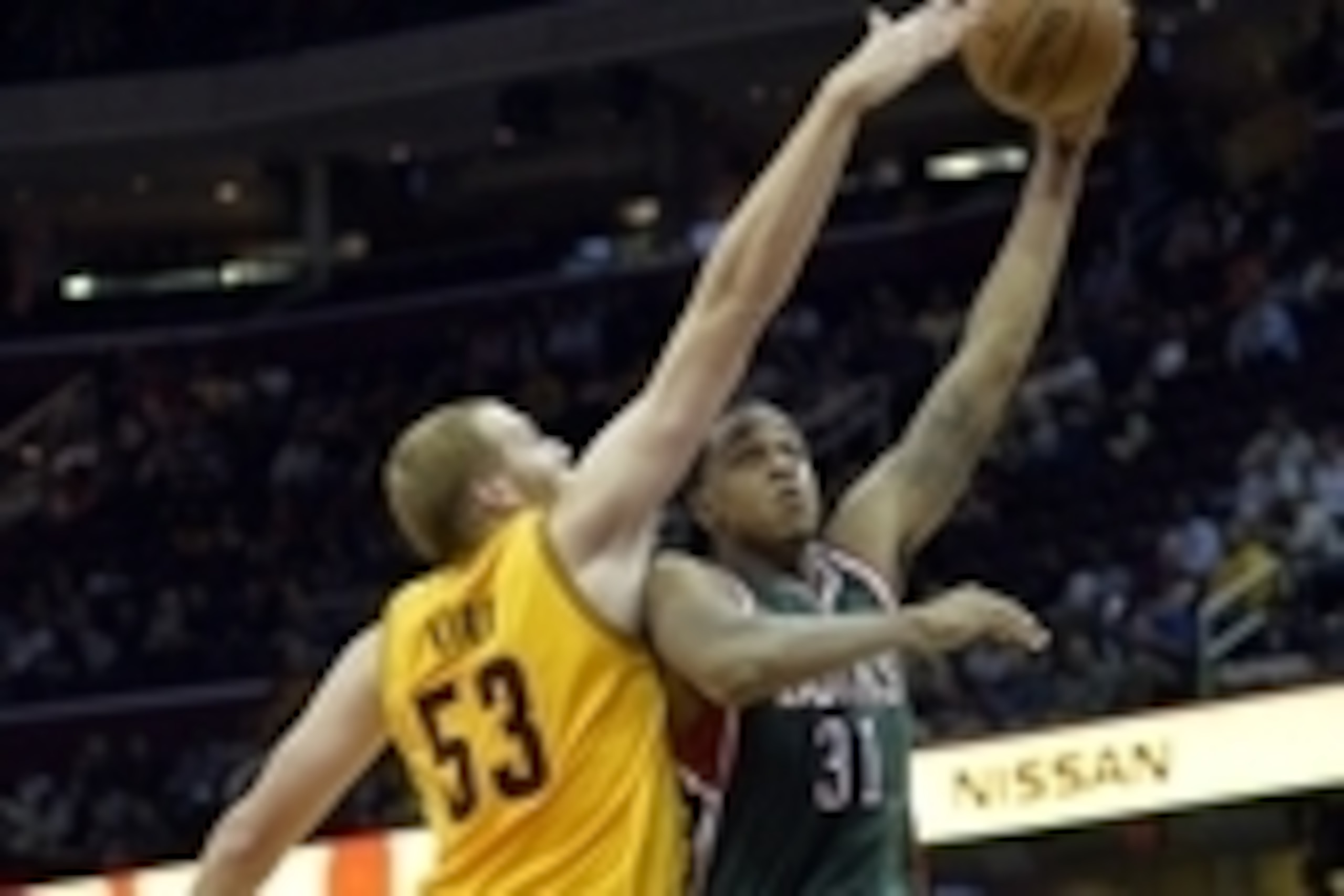 Oct 14, 2014; Cleveland, OH, USA; Milwaukee Bucks center John Henson (31) shoots against Cleveland Cavaliers center Alex Kirk (53) in the fourth quarter at Quicken Loans Arena. Mandatory Credit: David Richard-USA TODAY Sports