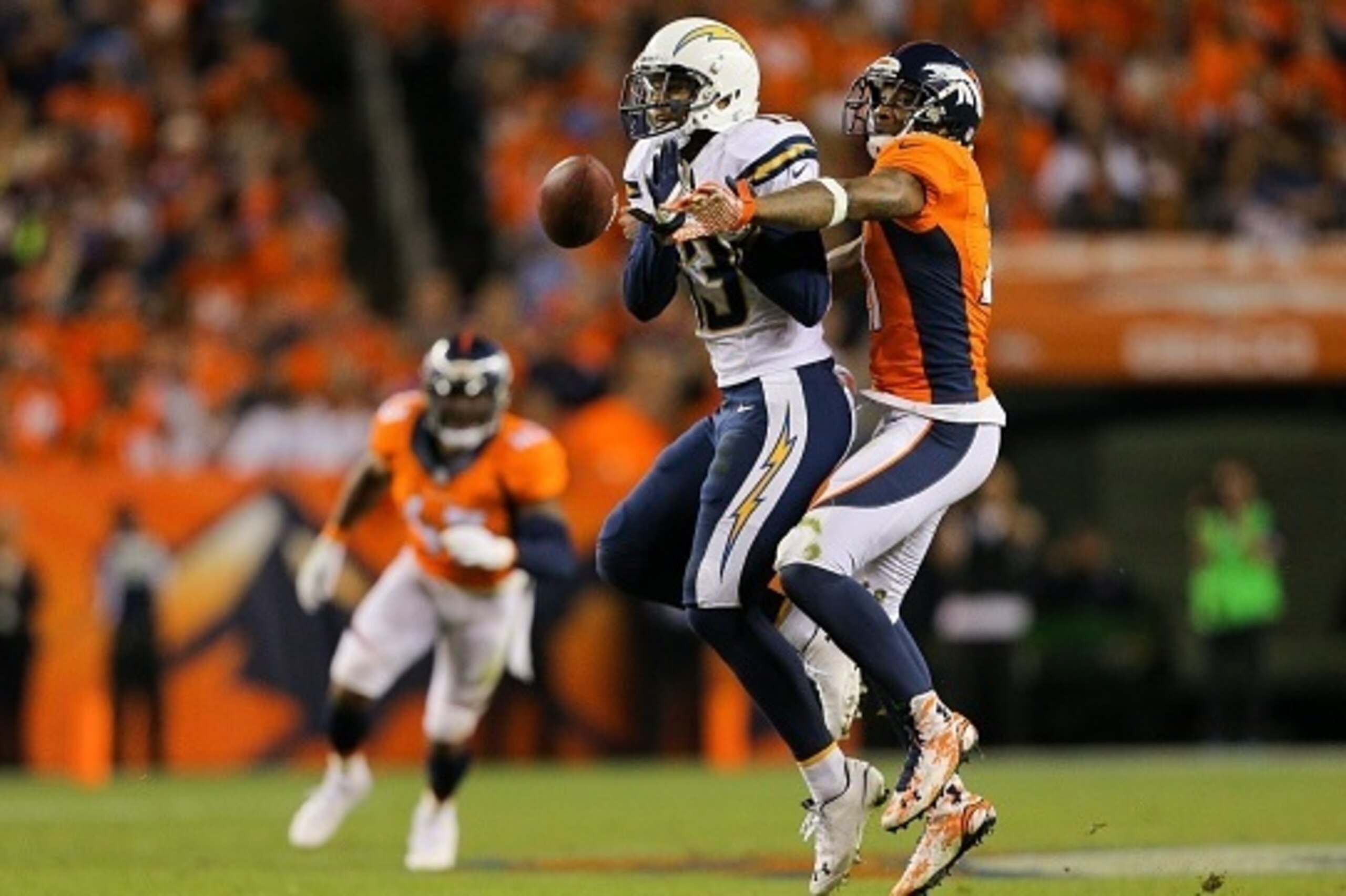 DENVER, CO - OCTOBER 23:  Cornerback Aqib Talib #21 of the Denver Broncos breaks up a pass intended for wide receiver Keenan Allen #13 of the San Diego Chargers at Sports Authority Field at Mile High on October 23, 2014 in Denver, Colorado.  (Photo by Jus