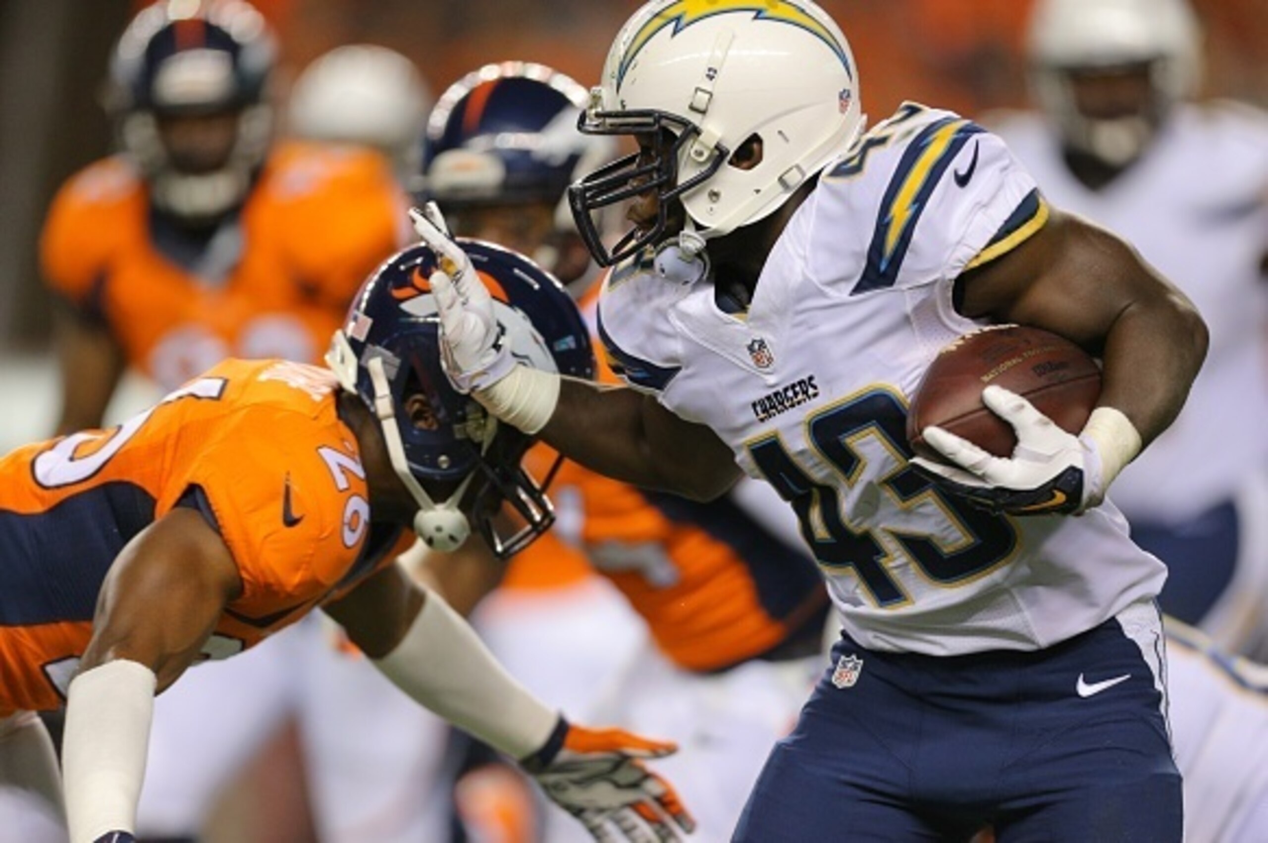 DENVER, CO - OCTOBER 23:  Running back Branden Oliver #43 of the San Diego Chargers rushes against the Denver Broncos during a game at Sports Authority Field at Mile High on October 23, 2014 in Denver, Colorado.  (Photo by Justin Edmonds/Getty Images)