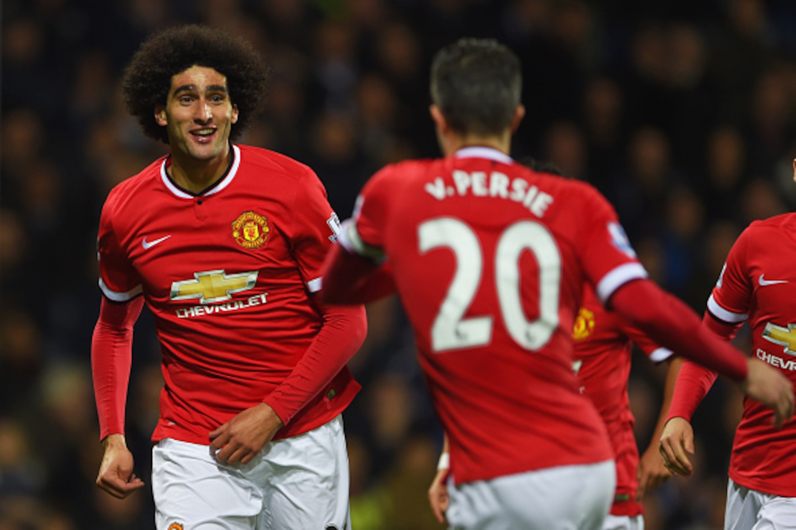 WEST BROMWICH, ENGLAND - OCTOBER 20: Marouane Fellaini of Manchester United celebrates with Robin van Persie (20) as he scores their first and equalising goal during the Barclays Premier League match between West Bromwich Albion and Manchester United at WEST BROMWICH, ENGLAND - OCTOBER 20: Marouane Fellaini of Manchester United celebrates with Robin van Persie (20) as he scores their first and equalising goal during the Barclays Premier League match between West Bromwich Albion and Manchester United at