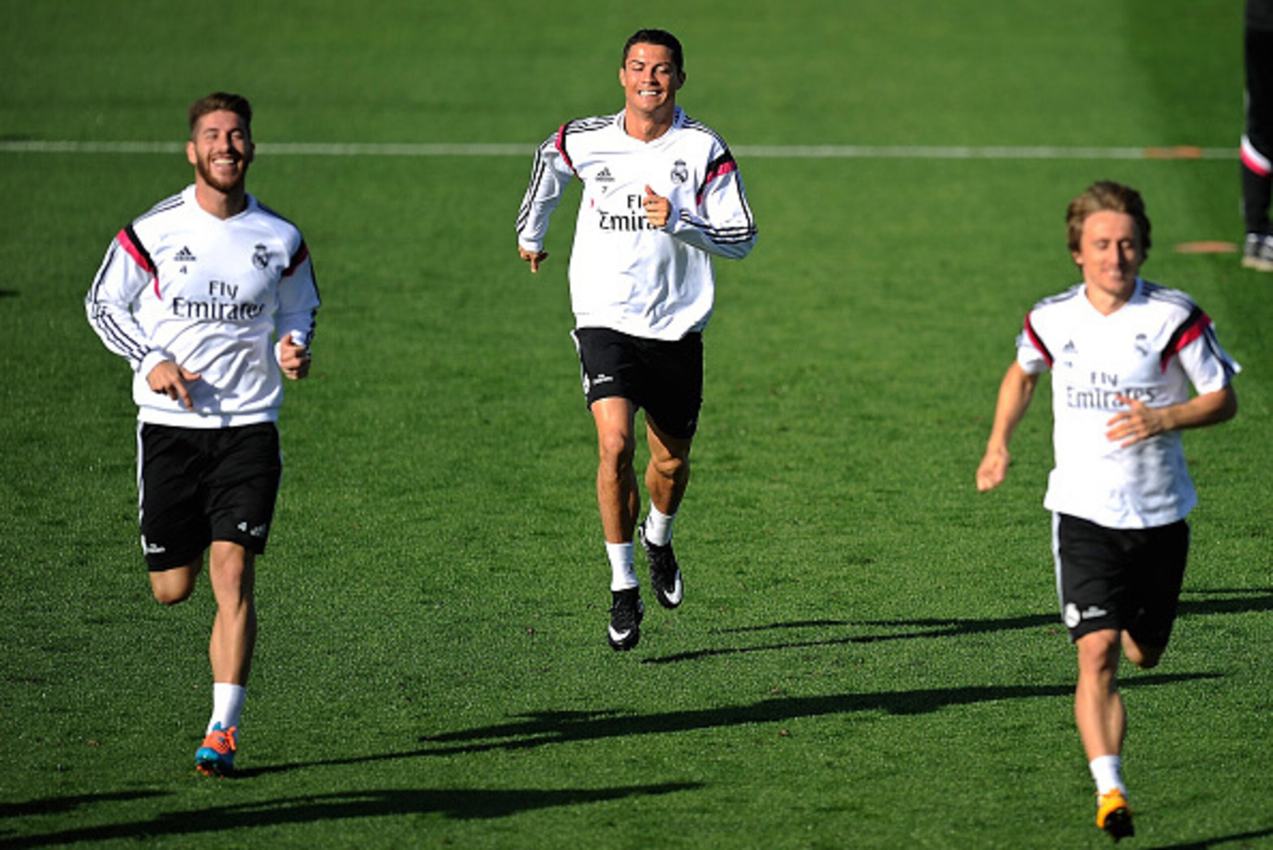MADRID, SPAIN - OCTOBER 24:  Cristiano Ronaldo, Sergio Ramos and Luka Modric of Real Madrid CF warm up during a team training session the day before their La Liga match against FC Barcelona at Ciudad Deportivo Real Madrid on October 24, 2014 in Madrid, Sp