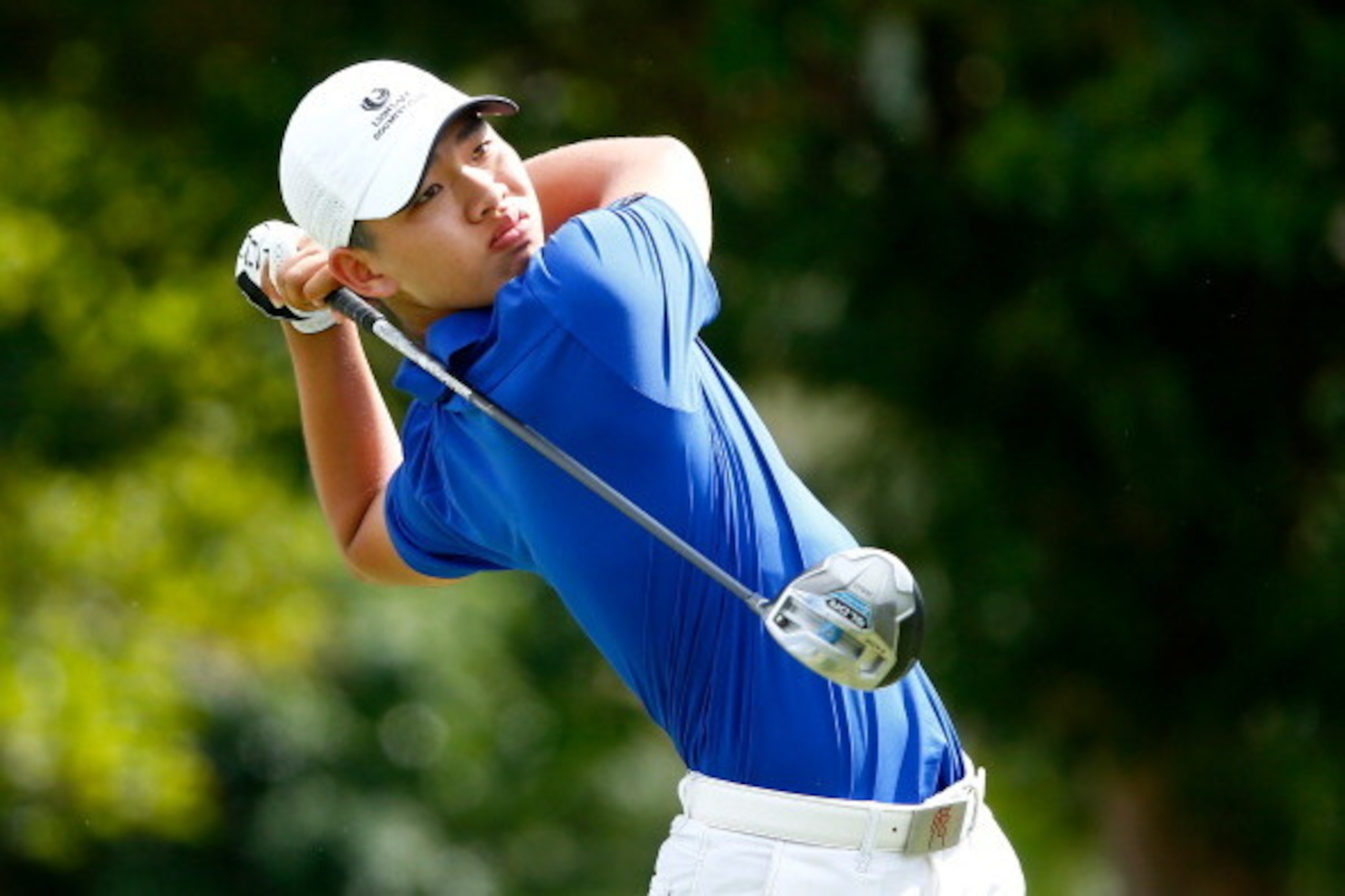 HONOLULU, HI - JANUARY 10:  Guan Tianlang of China plays a shot during the second round of the Sony Open in Hawaii at Waialae Country Club on January 10, 2014 in Honolulu, Hawaii.  (Photo by Sam Greenwood/Getty Images)