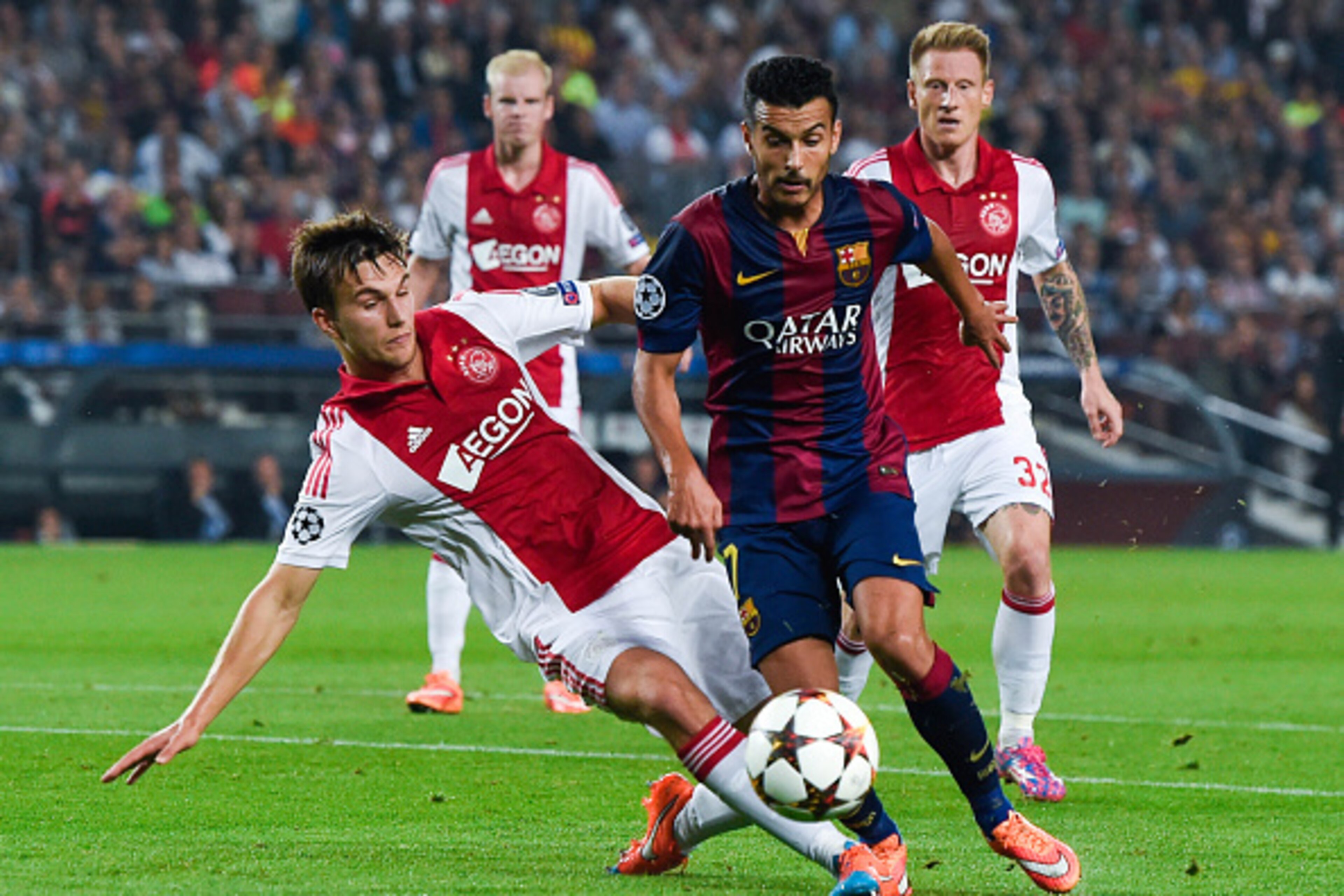 BARCELONA, SPAIN - OCTOBER 21: Pedro Rodriguez of FC Barcelona competes for the ball with Joel Veltman of AFC Ajax during a UEFA Champions League Group F match between FC Barcelona and AFC Ajax at the Camp Nou Stadium on October 21, 2014 in Barcelona, Spa BARCELONA, SPAIN - OCTOBER 21: Pedro Rodriguez of FC Barcelona competes for the ball with Joel Veltman of AFC Ajax during a UEFA Champions League Group F match between FC Barcelona and AFC Ajax at the Camp Nou Stadium on October 21, 2014 in Barcelona, Spa