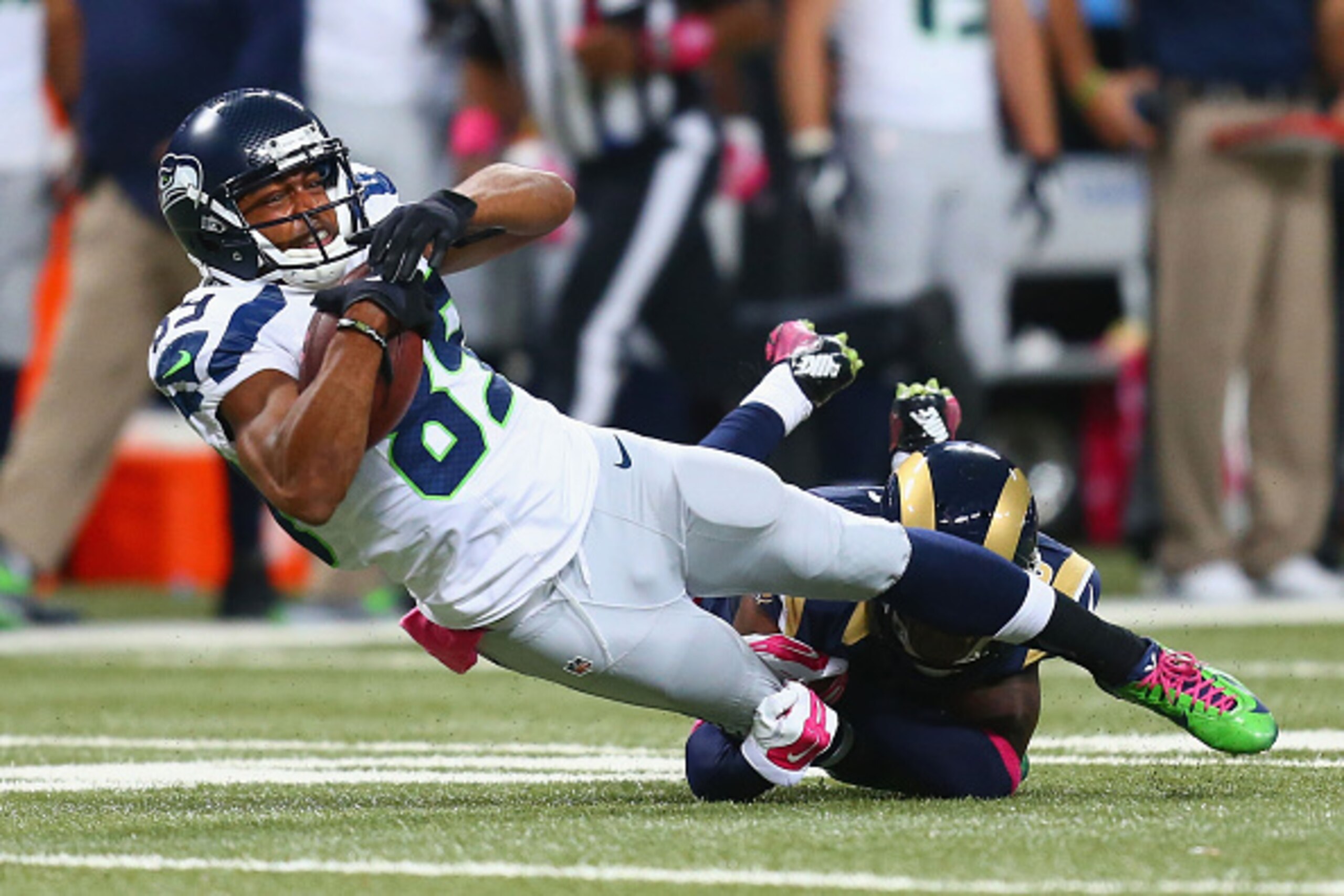 ST. LOUIS, MO - OCTOBER 19: Doug Baldwin #89 of the Seattle Seahawks is tackled after making a catch against the St. Louis Rams in the fourth quarter at the Edward Jones Dome on October 19, 2014 in St. Louis, Missouri.  The Rams beat the Seahawks 28-26.  