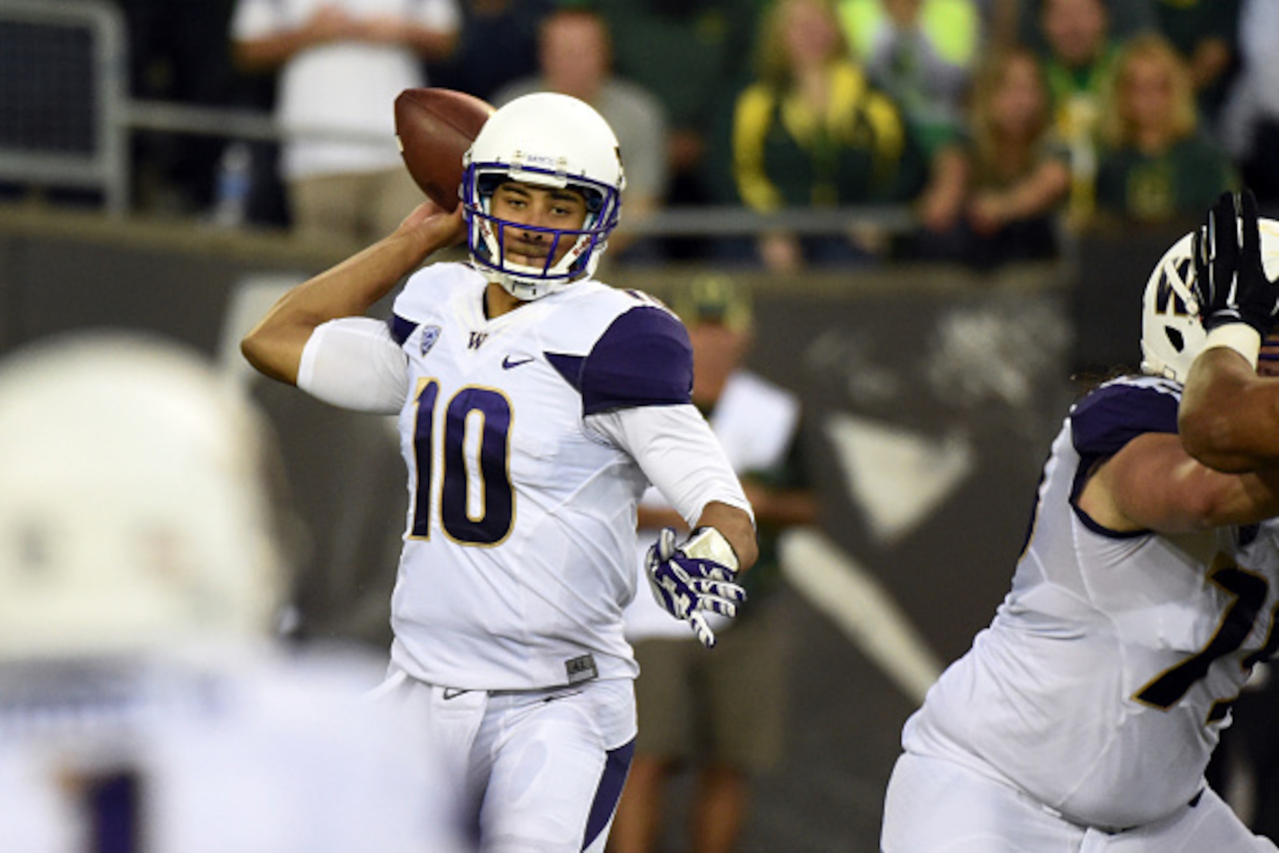 EUGENE,OR - OCTOBER 18: Quarterback Cyler Miles #10 of the Washington Huskies passes the ball during the second quarter of the game against the Oregon Ducks at Autzen Stadium on October 18, 2014 in Eugene, Oregon. (Photo by Steve Dykes/Getty Images)
