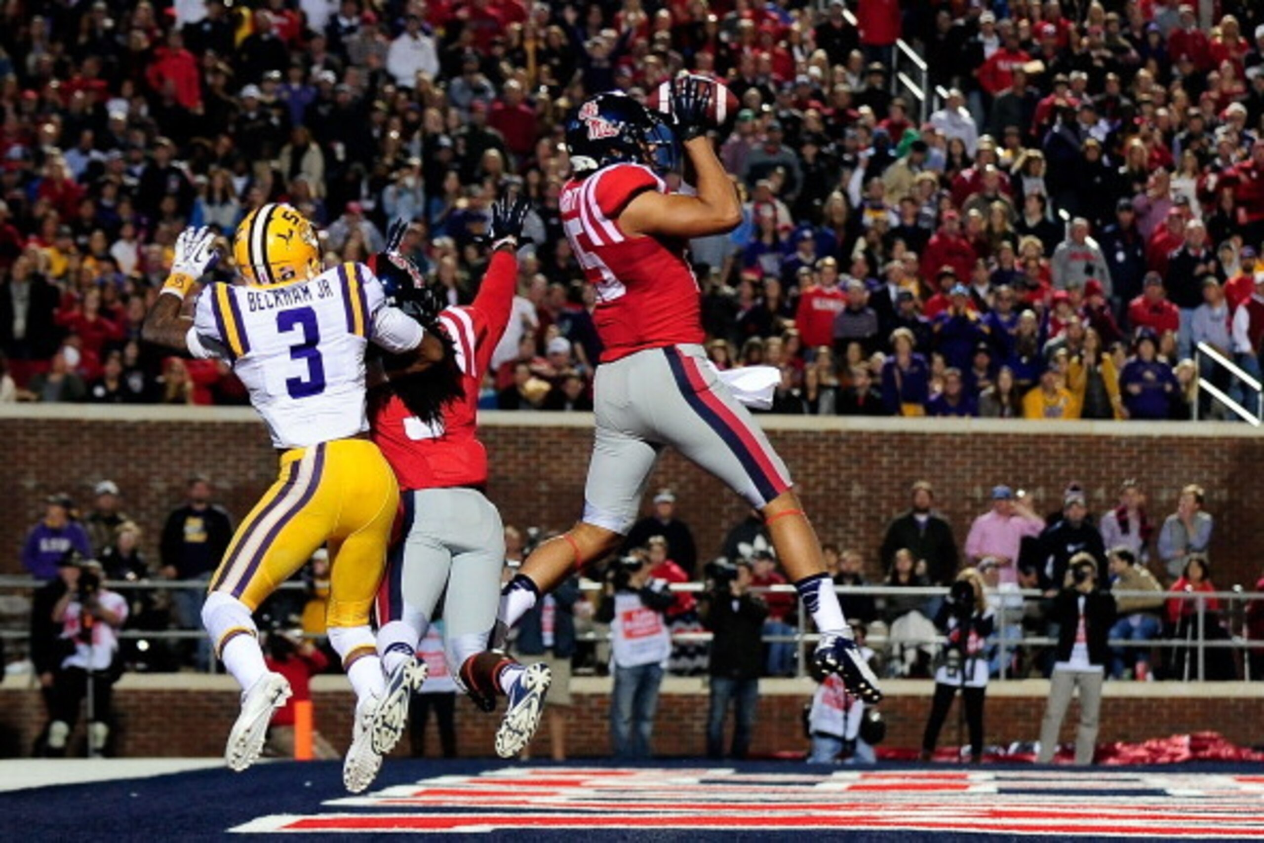 OXFORD, MS - OCTOBER 19:  Cody Prewitt #25 of the Ole Miss Rebels intercepts a pass intended for Odell Beckham Jr. #3 of the LSU Tigers during a game at Vaught-Hemingway Stadium on October 19, 2013 in Oxford, Mississippi.  (Photo by Stacy Revere/Getty Ima