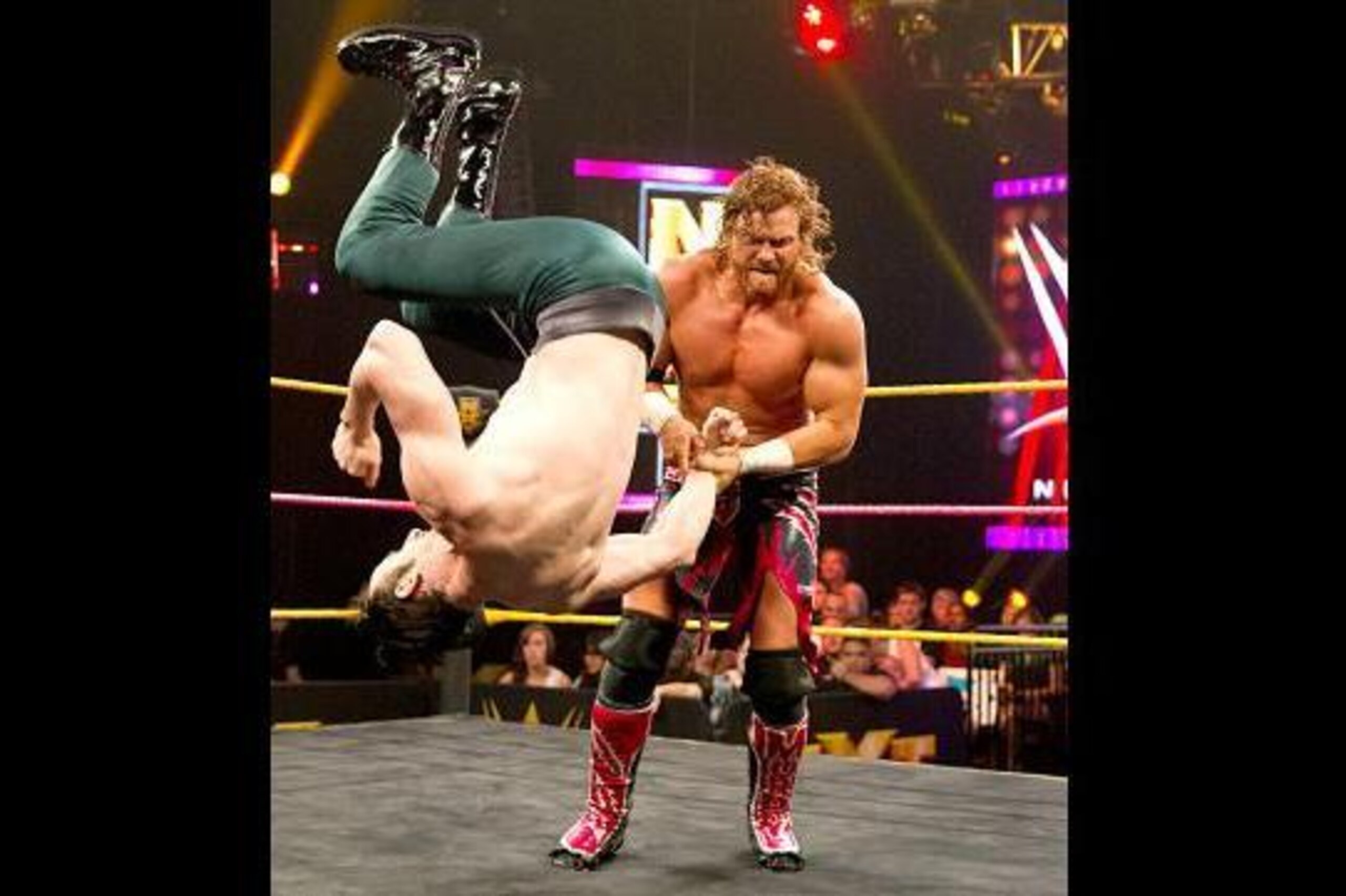 Buddy Murphy with a grip on Aiden English.