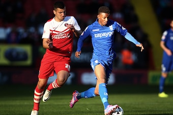 LONDON, ENGLAND - OCTOBER 04:  Demarai Gray (R) of Birmingham takes the ball past George Tucudean of Charlton during the Sky Bet Championship match between Charlton Athletic and Birmingham City at The Valley on October 4, 2014 in London, England.  (Photo 