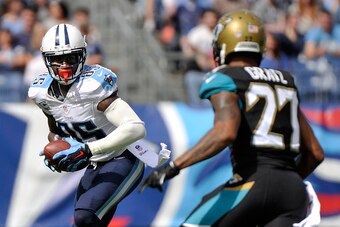 NASHVILLE, TN - OCTOBER 12:  Nate Washington #85 of the Tennessee Titans tries to avoid Dwayne Gratz #27 of the Jacksonville Jaguars during the second quarter of a game at LP Field on October 12, 2014 in Nashville, Tennessee.  (Photo by Frederick Breedon/