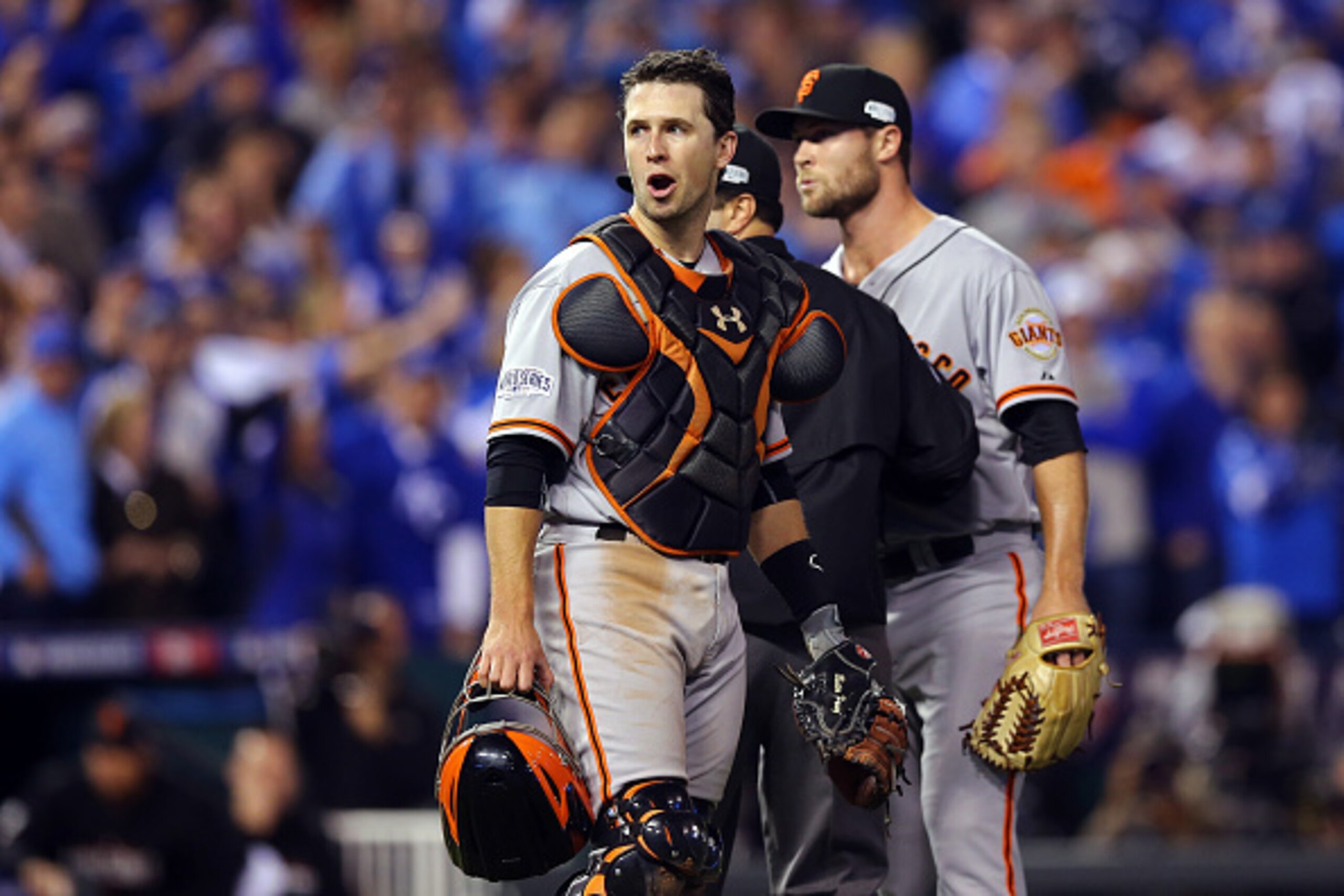 KANSAS CITY, MO - OCTOBER 22: Buster Posey #28 of the San Francisco Giants reacts after words were exchanged between Hunter Strickland #60 and Salvador Perez #13 of the Kansas City Royals in the sixth inning during Game Two of the 2014 World Series at Kau KANSAS CITY, MO - OCTOBER 22: Buster Posey #28 of the San Francisco Giants reacts after words were exchanged between Hunter Strickland #60 and Salvador Perez #13 of the Kansas City Royals in the sixth inning during Game Two of the 2014 World Series at Kau