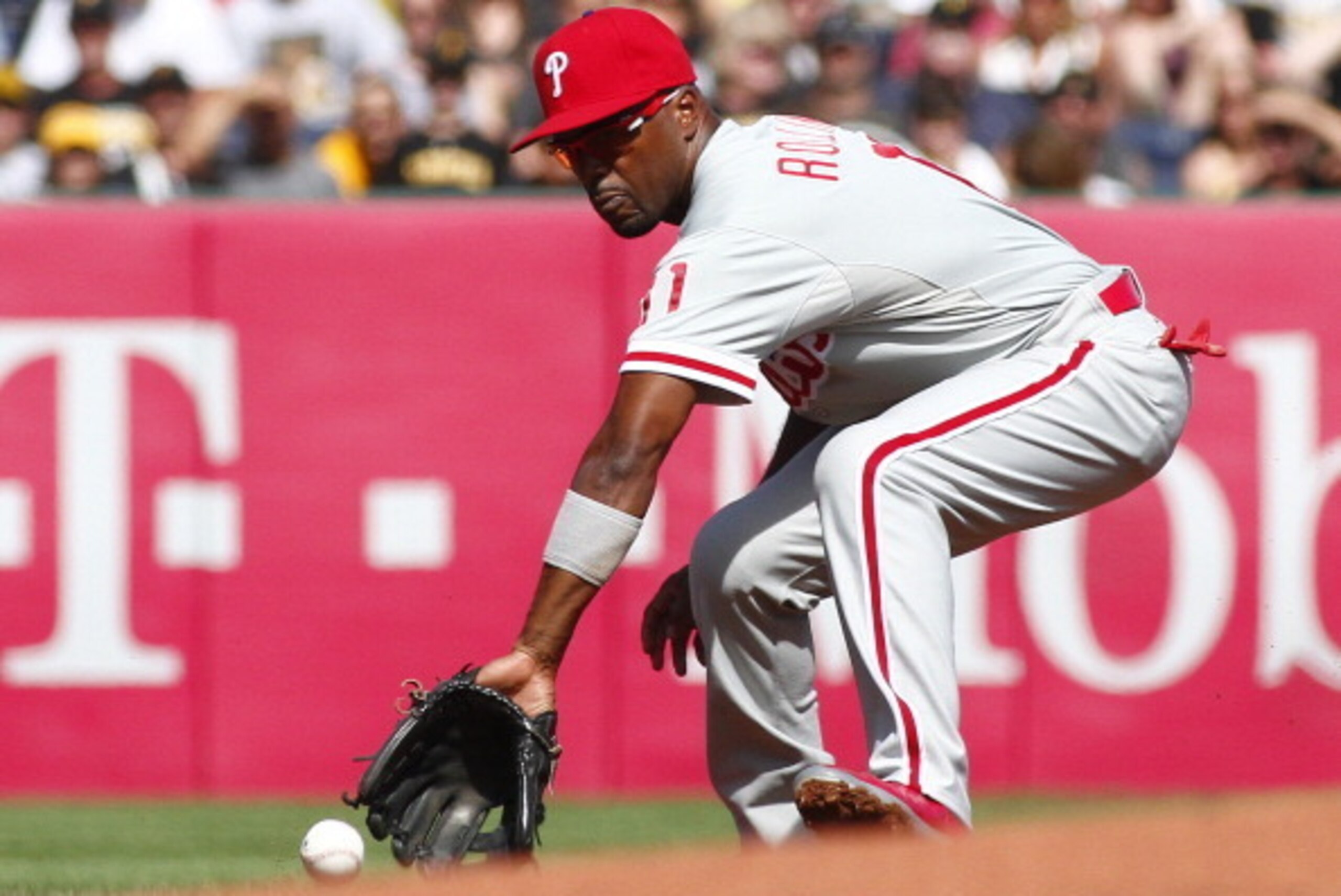 PITTSBURGH, PA - JULY 05:  Jimmy Rollins #11 of the Philadelphia Phillies fields a ground ball in the first inning against the Pittsburgh Pirates during the game at PNC Park on July 5, 2014 in Pittsburgh, Pennsylvania.  (Photo by Justin K. Aller/Getty Ima