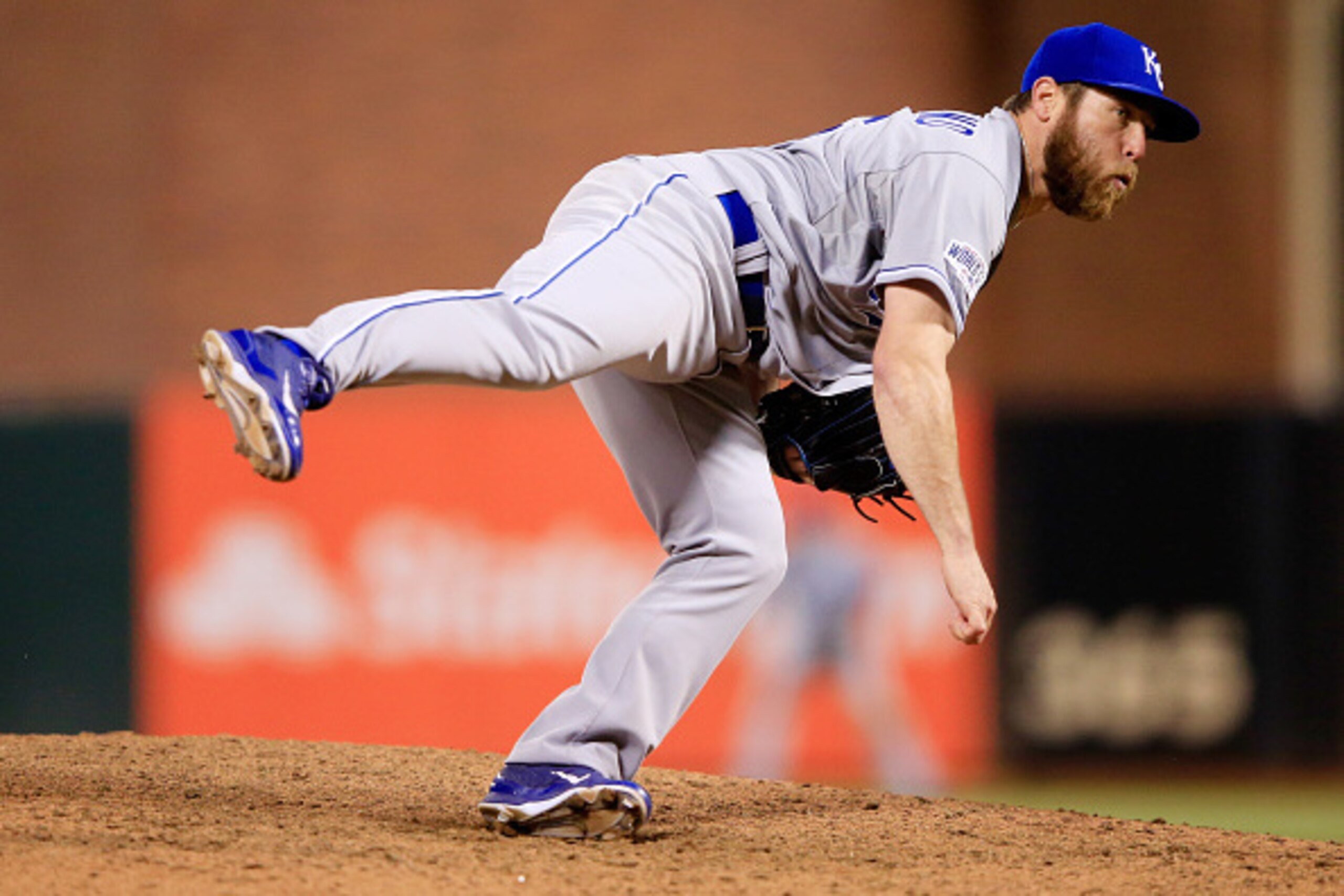 SAN FRANCISCO, CA - OCTOBER 24:  Greg Holland #56 of the Kansas City Royals pitches in the ninth inning against the San Francisco Giants during Game Three of the 2014 World Series at AT&T Park on October 24, 2014 in San Francisco, California.  (Photo by J