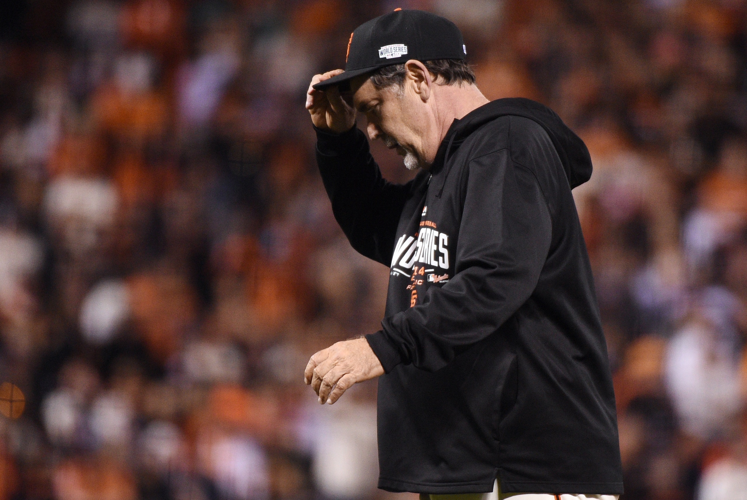 Oct 24, 2014; San Francisco, CA, USA; San Francisco Giants manager Bruce Bochy walks back to the dugout after a pitching change against the Kansas City Royals in the 9th inning during game three of the 2014 World Series at AT&T Park. Mandatory Credit: Kyl
