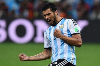 SAO PAULO, BRAZIL - JULY 09:  Ezequiel Garay of Argentina celebrates scoring his penalty kick during a shootout during the 2014 FIFA World Cup Brazil Semi Final match between the Netherlands and Argentina at Arena de Sao Paulo on July 9, 2014 in Sao Paulo