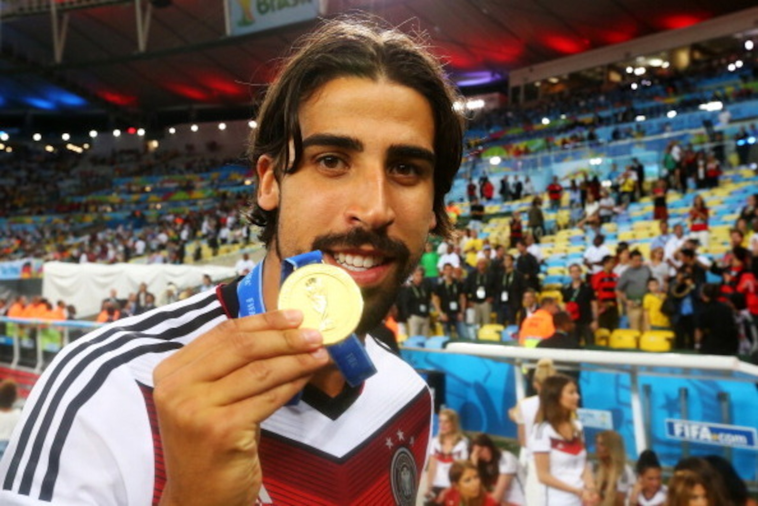 RIO DE JANEIRO, BRAZIL - JULY 13:  Sami Khedira of Germany celebrates with his medal after defeating Argentina 1-0 in extra-time during the 2014 FIFA World Cup Brazil Final match between Germany and Argentina at Maracana on July 13, 2014 in Rio de Janeiro