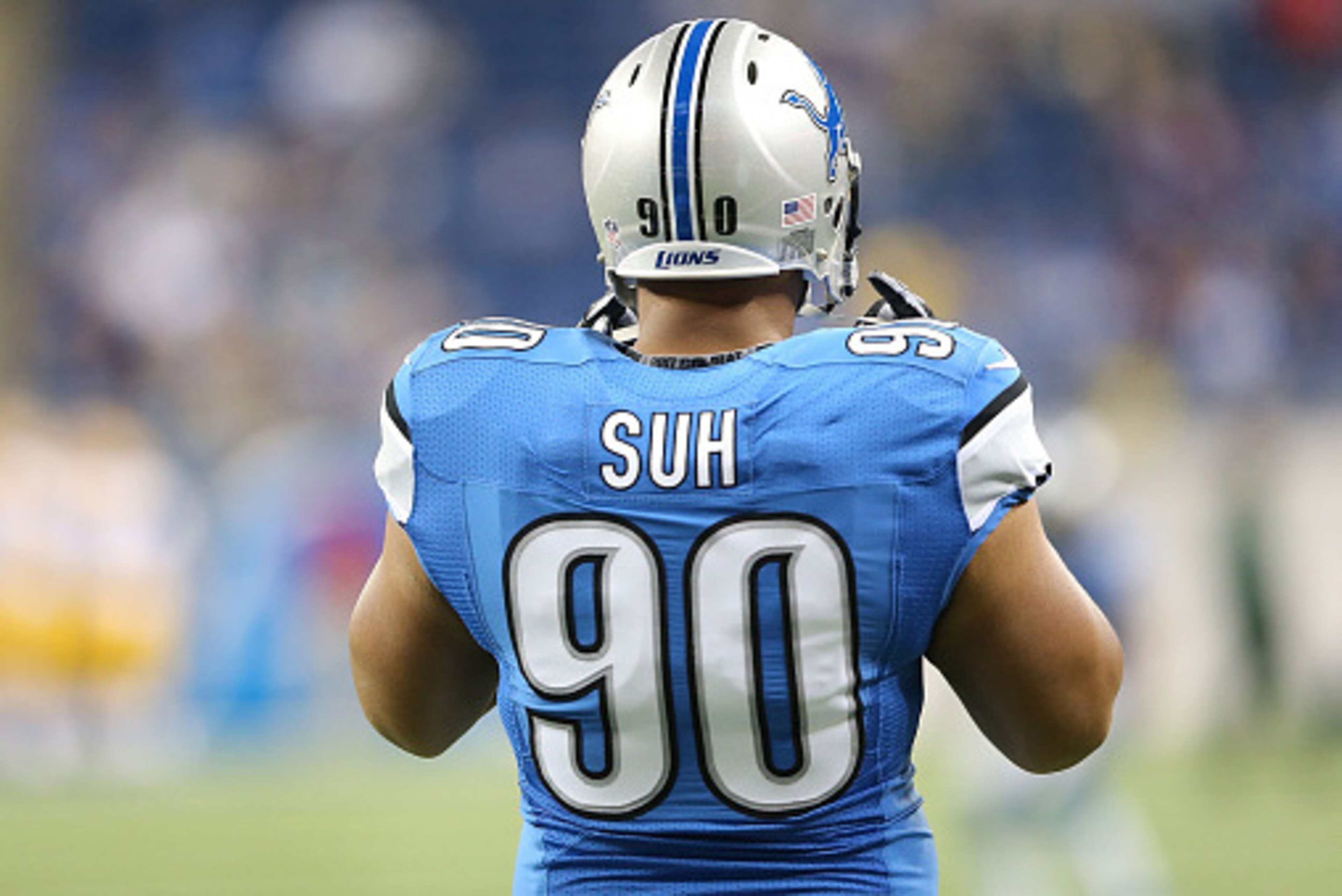 DETROIT, MI - SEPTEMBER 21:  Ndamukong Suh #90 of the Detroit Lions warms up prior to the start of the game against the Green Bay Packers at Ford Field on September 21, 2014 in Detroit, Michigan. The Lions defeated the Packers 19-7.  (Photo by Leon Halip/