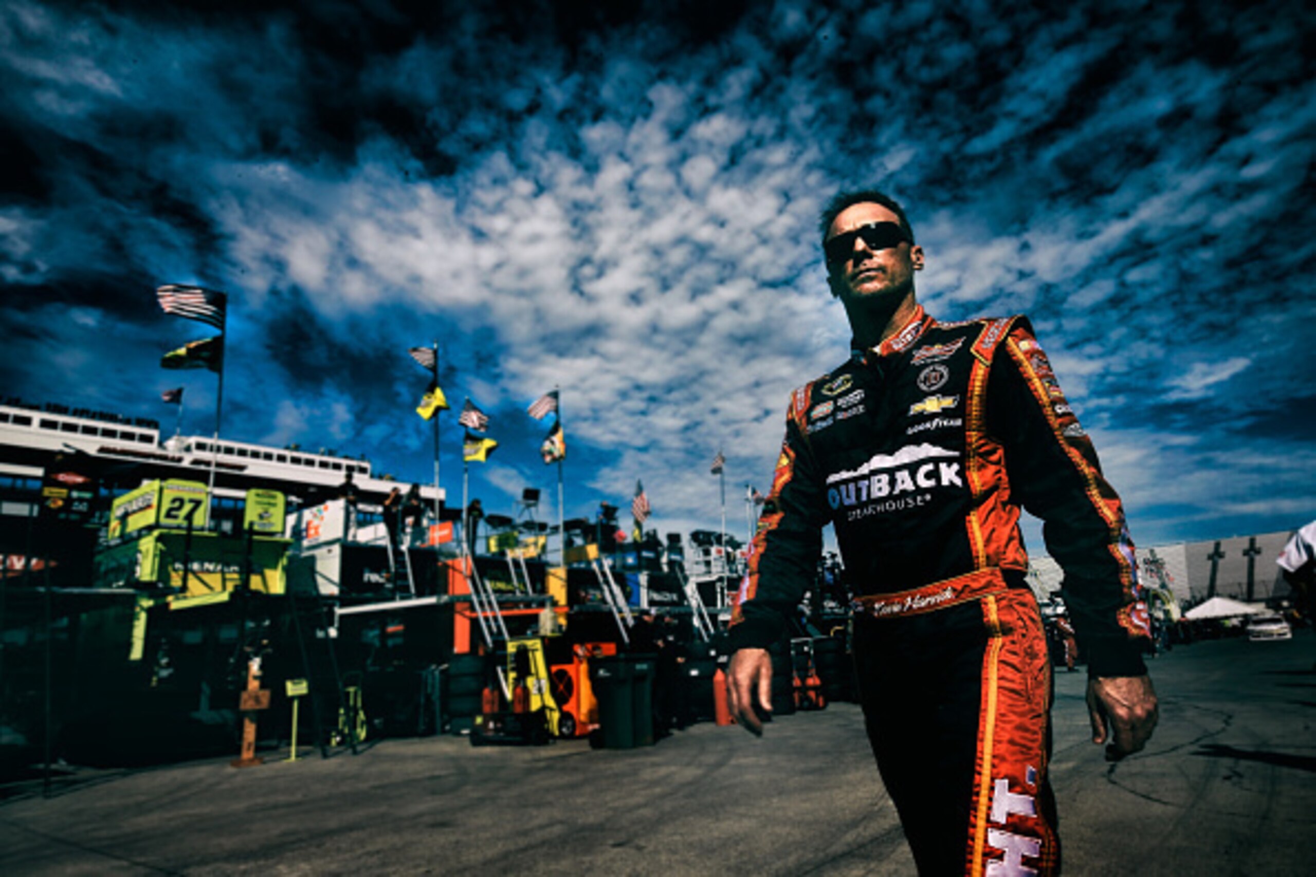 MARTINSVILLE, VA - OCTOBER 24:  (EDITORS NOTE: Image has been processed using digital filters) Kevin Harvick, driver of the #4 Outback Steakhouse Chevrolet, stands in the garage area during practice for the NASCAR Sprint Cup Series Goody's Headache Relief