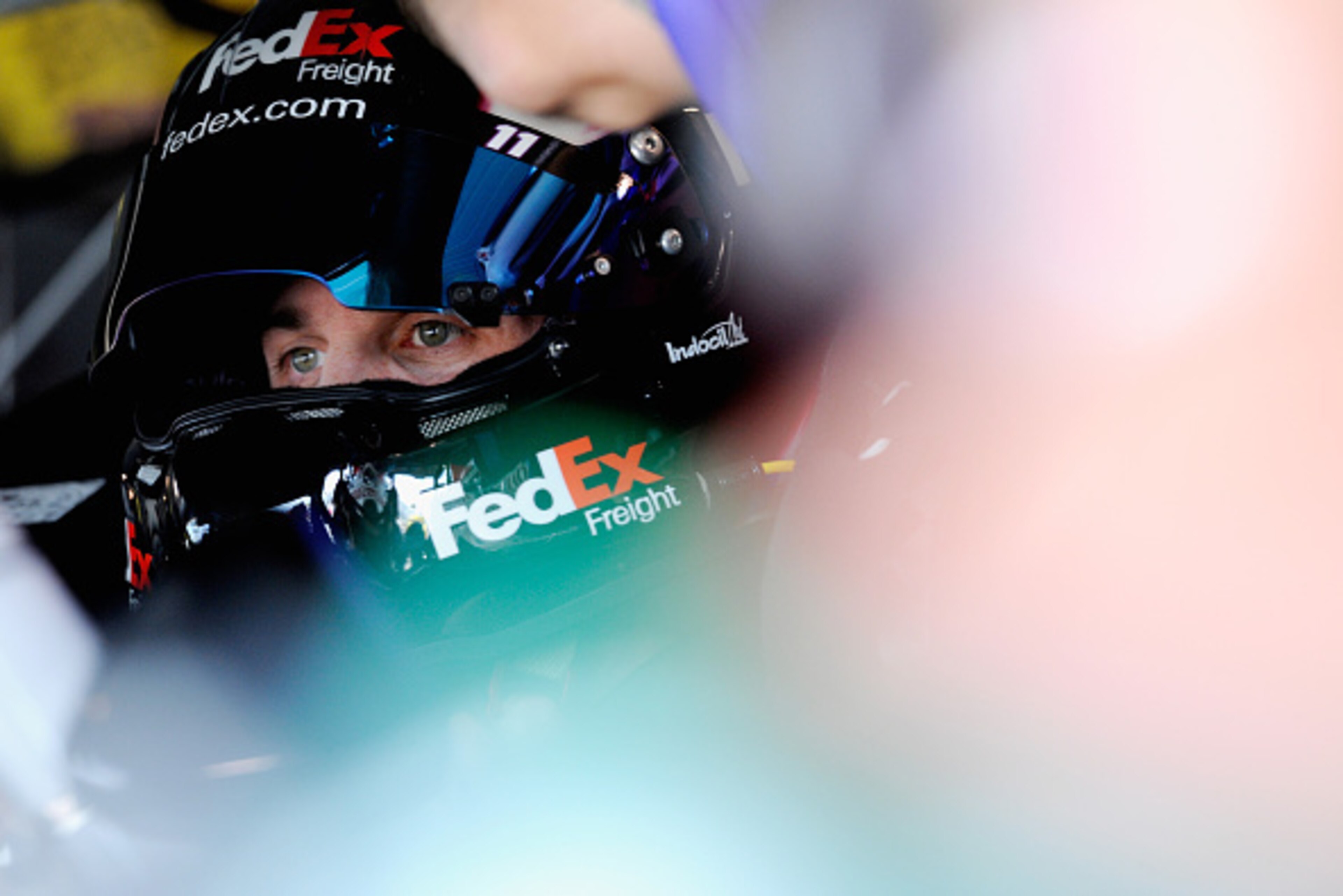 MARTINSVILLE, VA - OCTOBER 24:  Denny Hamlin, driver of the #11 FedEx Freight Toyota, sits in his car in the garage area during practice for the NASCAR Sprint Cup Series Goody's Headache Relief Shot 500 at Martinsville Speedway on October 24, 2014 in Mart