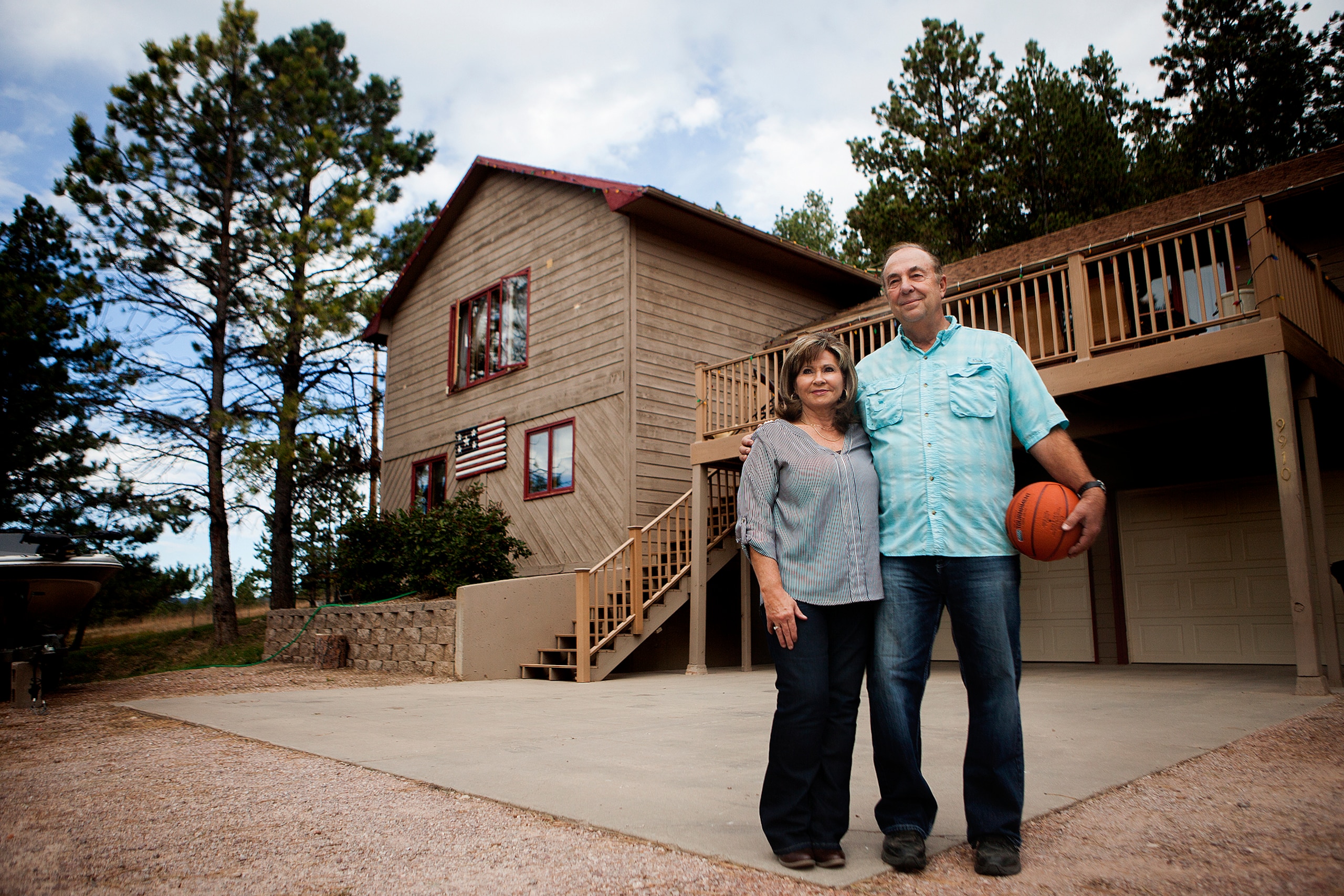 Bev and Marty Hammon, Becky's parents, in front of their Rapid City home.