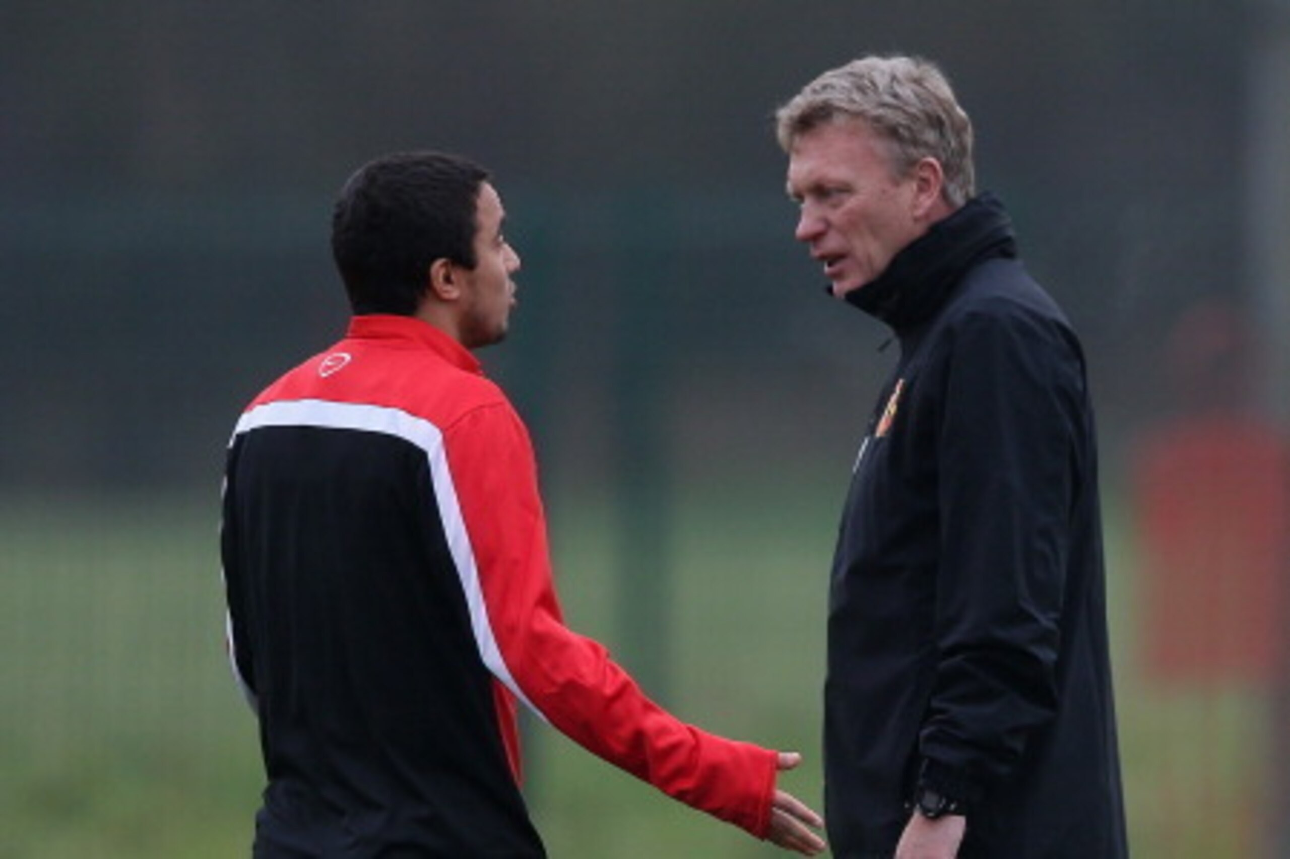 MANCHESTER, ENGLAND - NOVEMBER 26:  Manchester United manager David Moyes talks to his player Rafael Da Silva during a first team training session ahead of their UEFA Champions League match against Bayer Leverkusen at the Aon Training Complex at Carringto