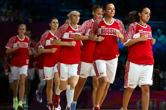 Becky Hammon leads the Russian team onto the floor at the 2008 Olympics.