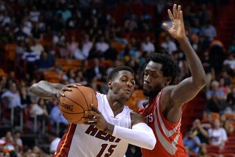 Oct 21, 2014; Miami, FL, USA; Miami Heat guard Mario Chalmers (15) is presumed by Houston Rockets guard Patrick Beverley (2) during the second half at American Airlines Arena. Mandatory Credit: Steve Mitchell-USA TODAY Sports