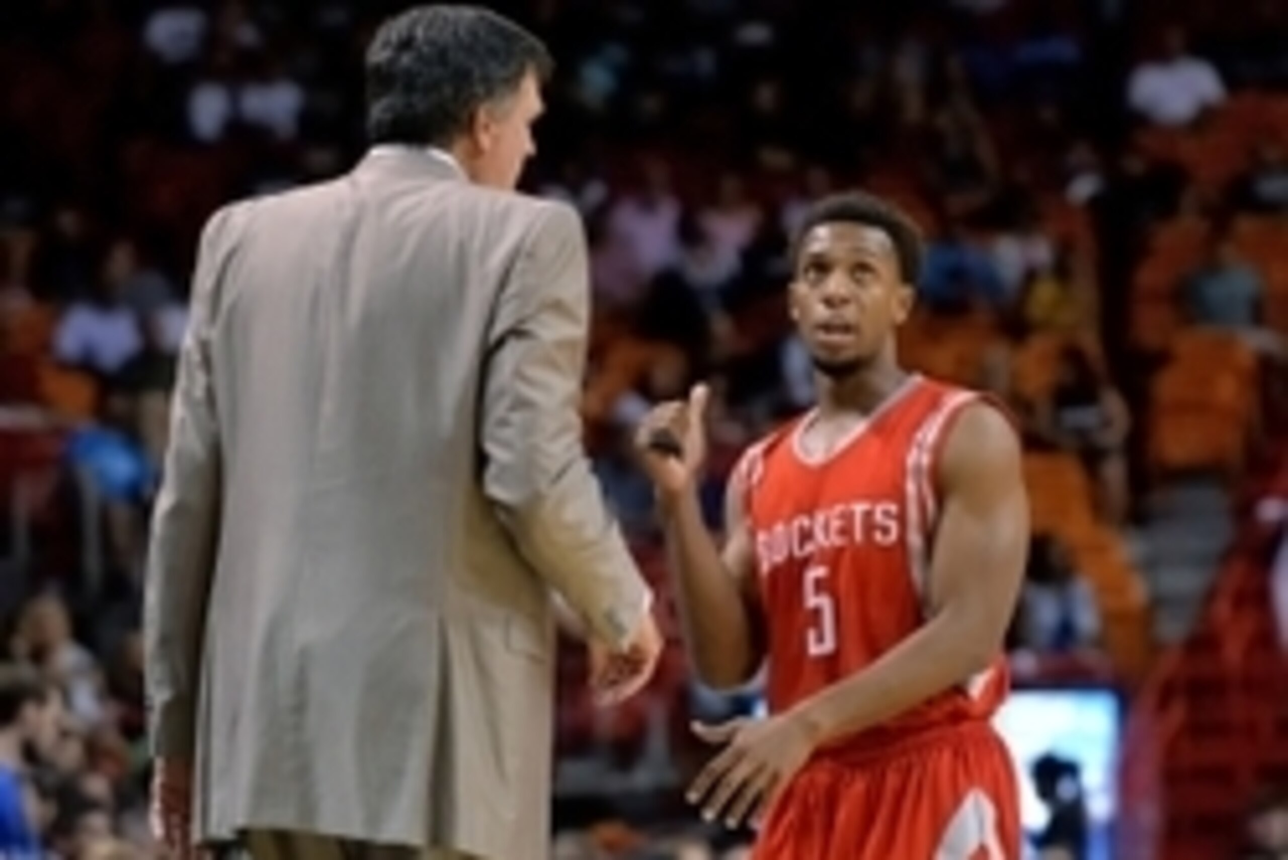 Oct 21, 2014; Miami, FL, USA; Houston Rockets guard Ish Smith (right) talks with head coach Kevin McHale (left) during the first half against the Miami Heat at American Airlines Arena. Mandatory Credit: Steve Mitchell-USA TODAY Sports