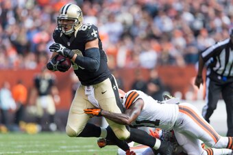 CLEVELAND, OH - SEPTEMBER 14:  Jimmy Graham #80 of the New Orleans Saints gets tackled by Donte Whitner #31 of the Cleveland Browns during the second quarter at FirstEnergy Stadium on September 14, 2014 in Cleveland, Ohio.  (Photo by Jason Miller/Getty Im
