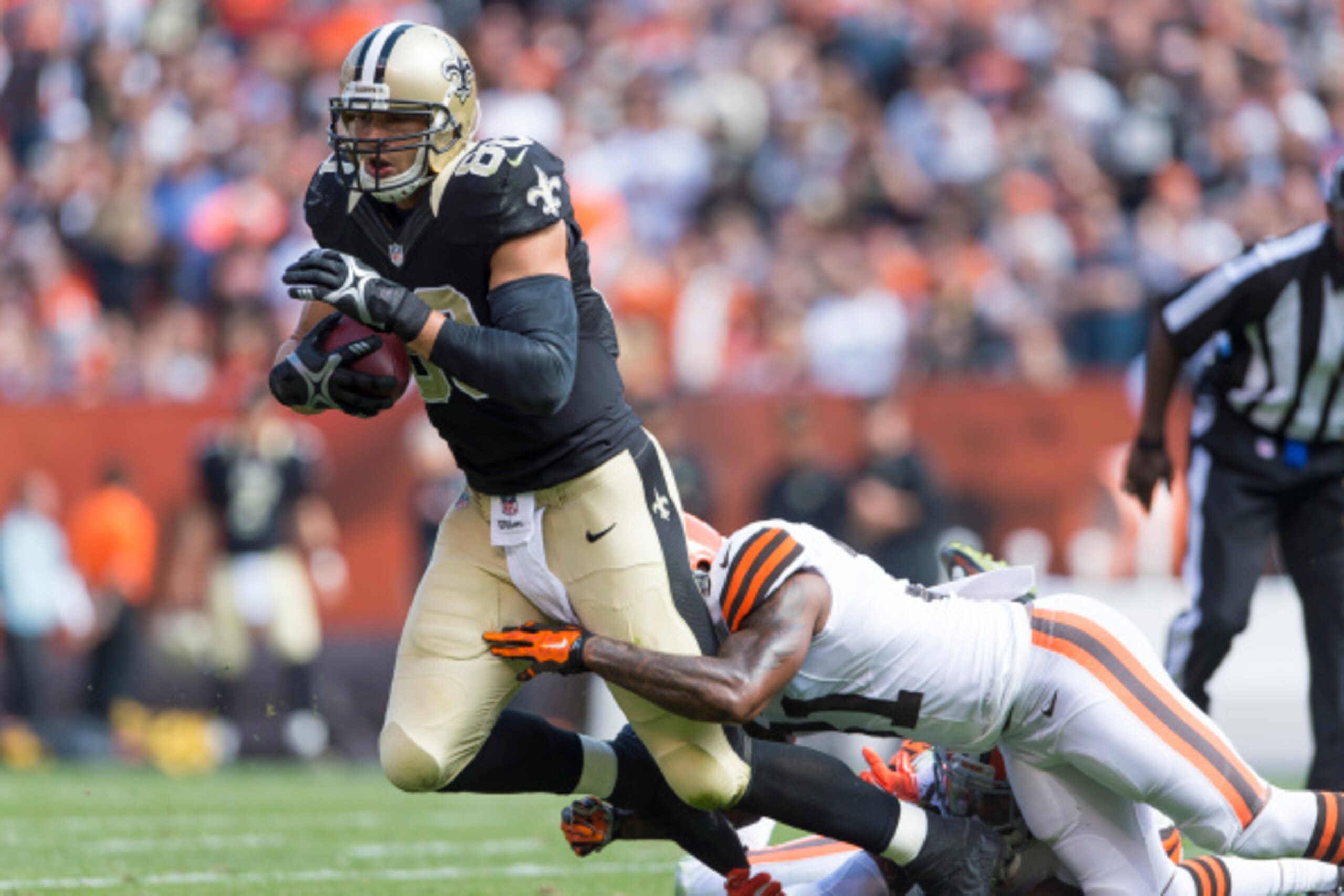 CLEVELAND, OH - SEPTEMBER 14:  Jimmy Graham #80 of the New Orleans Saints gets tackled by Donte Whitner #31 of the Cleveland Browns during the second quarter at FirstEnergy Stadium on September 14, 2014 in Cleveland, Ohio.  (Photo by Jason Miller/Getty Im