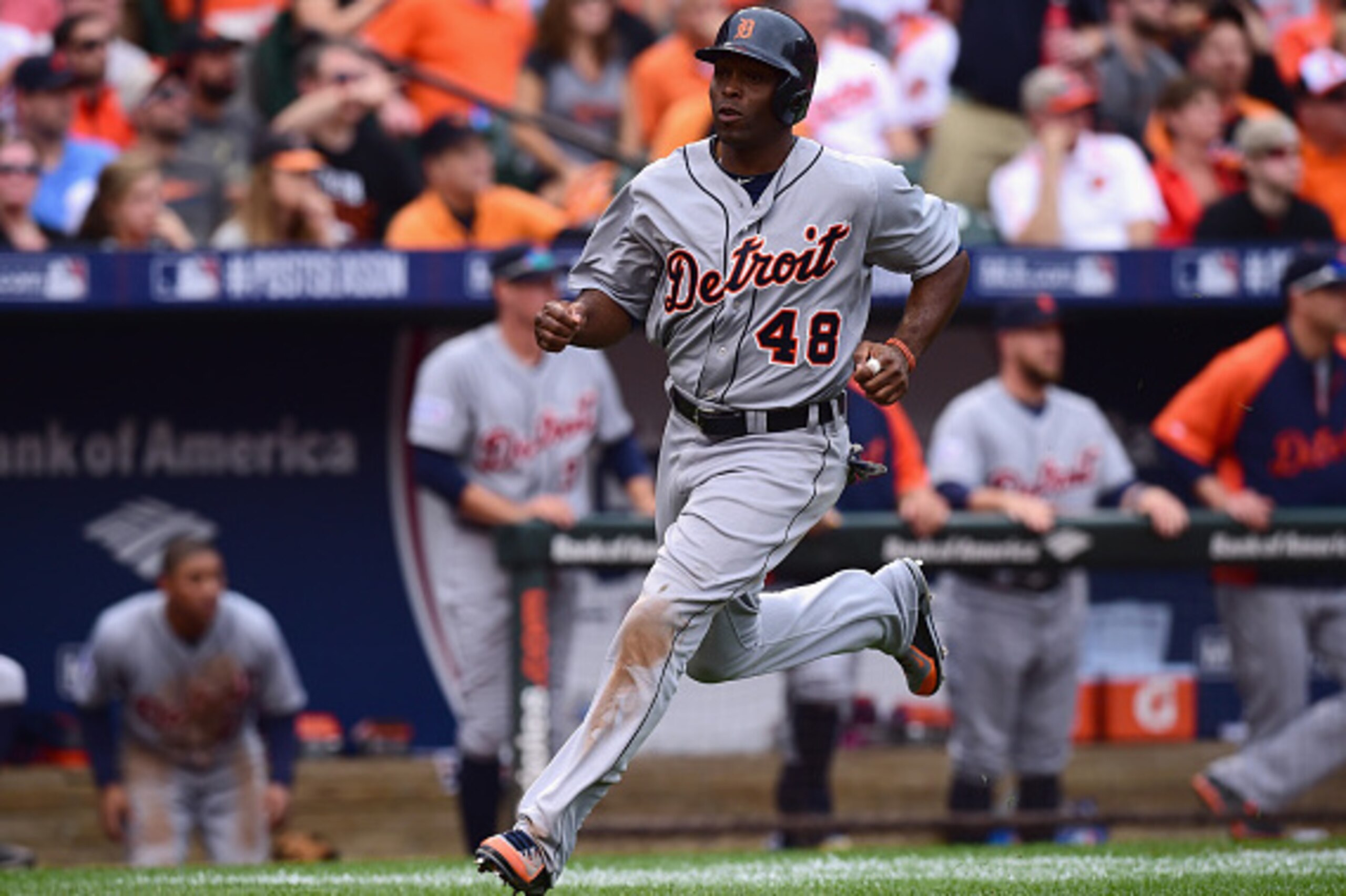 BALTIMORE, MD - OCTOBER 03:  Torii Hunter #48 of the Detroit Tigers scores on a double to deep center field hit Victor Martinez #41 against Kevin Gausman #39 of the Baltimore Orioles in the eighth inning during Game Two of the American League Division Ser