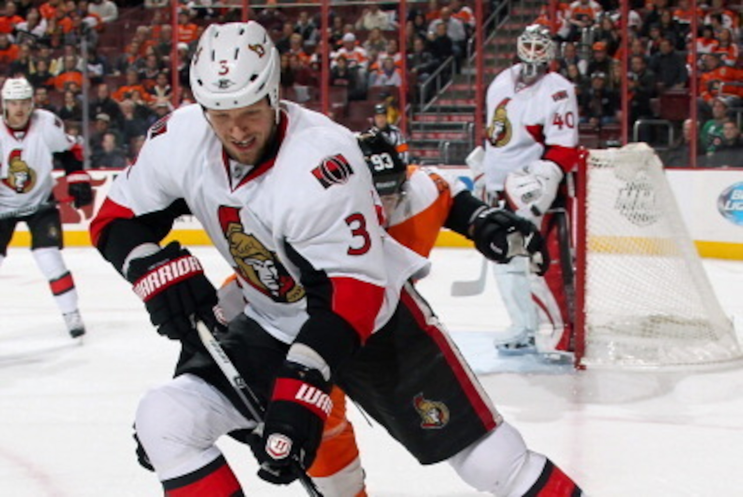 PHILADELPHIA, PA - NOVEMBER 19:  Mark Methot #3 of the Ottawa Senators battles in the corner with Jakub Voracek #93 of the Philadelphia Flyers for control of the loose puck on November 19, 2013 at the Wells Fargo Center in Philadelphia, Pennsylvania.  (Ph