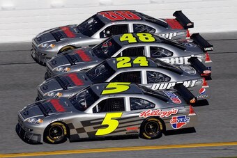 DAYTONA BEACH, FL - FEBRUARY 07:  Hendricks Motorsports drivers Mark Martin, Jeff Gordon, Jimmie Johnson, and Dale Earnhardt Jr. drive a comemorative car prior to practice for the NASCAR Sprint Cup Series Daytona 500 at Daytona International Speedway on F