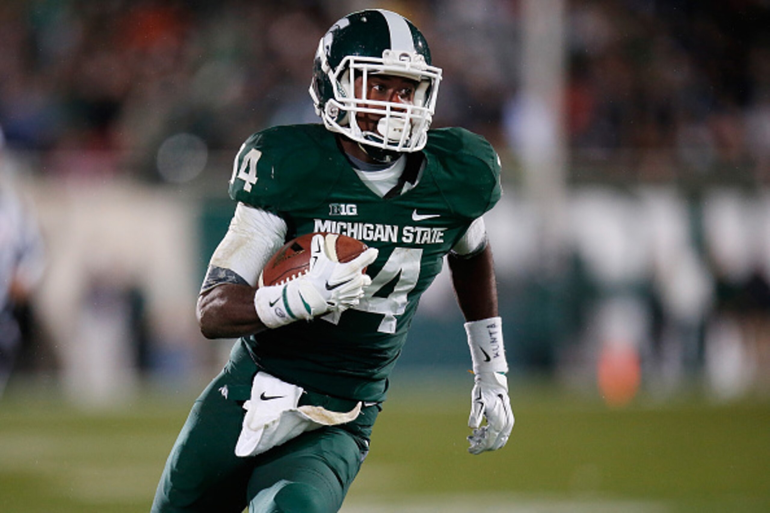 EAST LANSING, MI - OCTOBER 04: Tony Lippett #14 of the Michigan State Spartans runs for a third quarter touchdown while playing the Nebraska Cornhuskers at Spartan Stadium on October 4, 2014 in East Lansing, Michigan. (Photo by Gregory Shamus/Getty Images