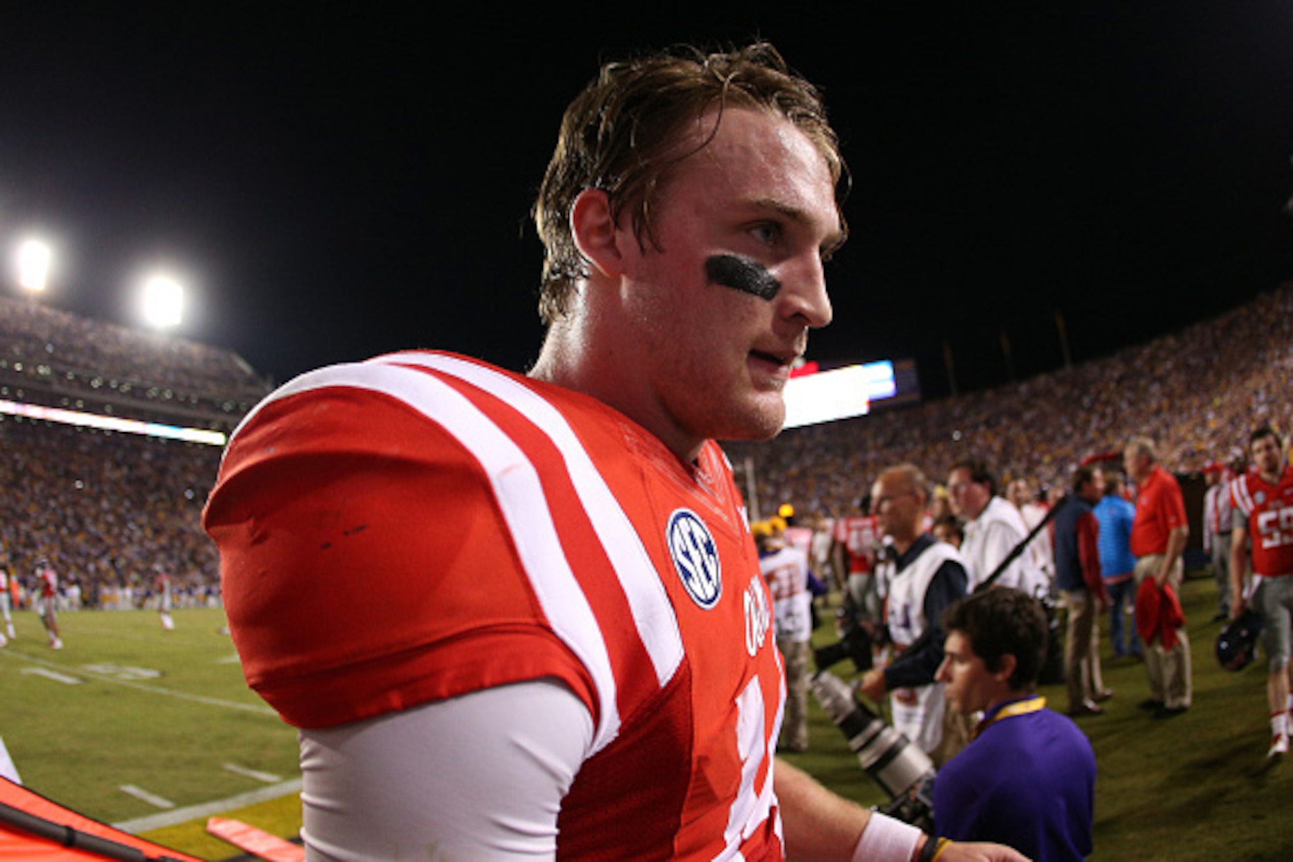 BATON ROUGE, LA - OCTOBER 25:  Quarterback Bo Wallace #14 of the Mississippi Rebels walks off the field after losing 10-7 to the LSU Tigers at Tiger Stadium on October 25, 2014 in Baton Rouge, Louisiana.  (Photo by Chris Graythen/Getty Images)