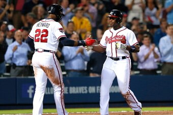 ATLANTA, GA - MAY 19:  Justin Upton #8 of the Atlanta Braves celebrates his two-run homer in the eighth inning against the Milwaukee Brewers that also scored Jason Heyward #22 at Turner Field on May 19, 2014 in Atlanta, Georgia.  (Photo by Kevin C. Cox/Ge