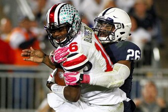 STATE COLLEGE, PA - OCTOBER 25:  Brandon Bell #26 of the Penn State Nittany Lions sacks J.T. Barrett #16 of the Ohio State Buckeyes in the second half during the game on October 25, 2014 at Beaver Stadium in State College, Pennsylvania.  (Photo by Justin 
