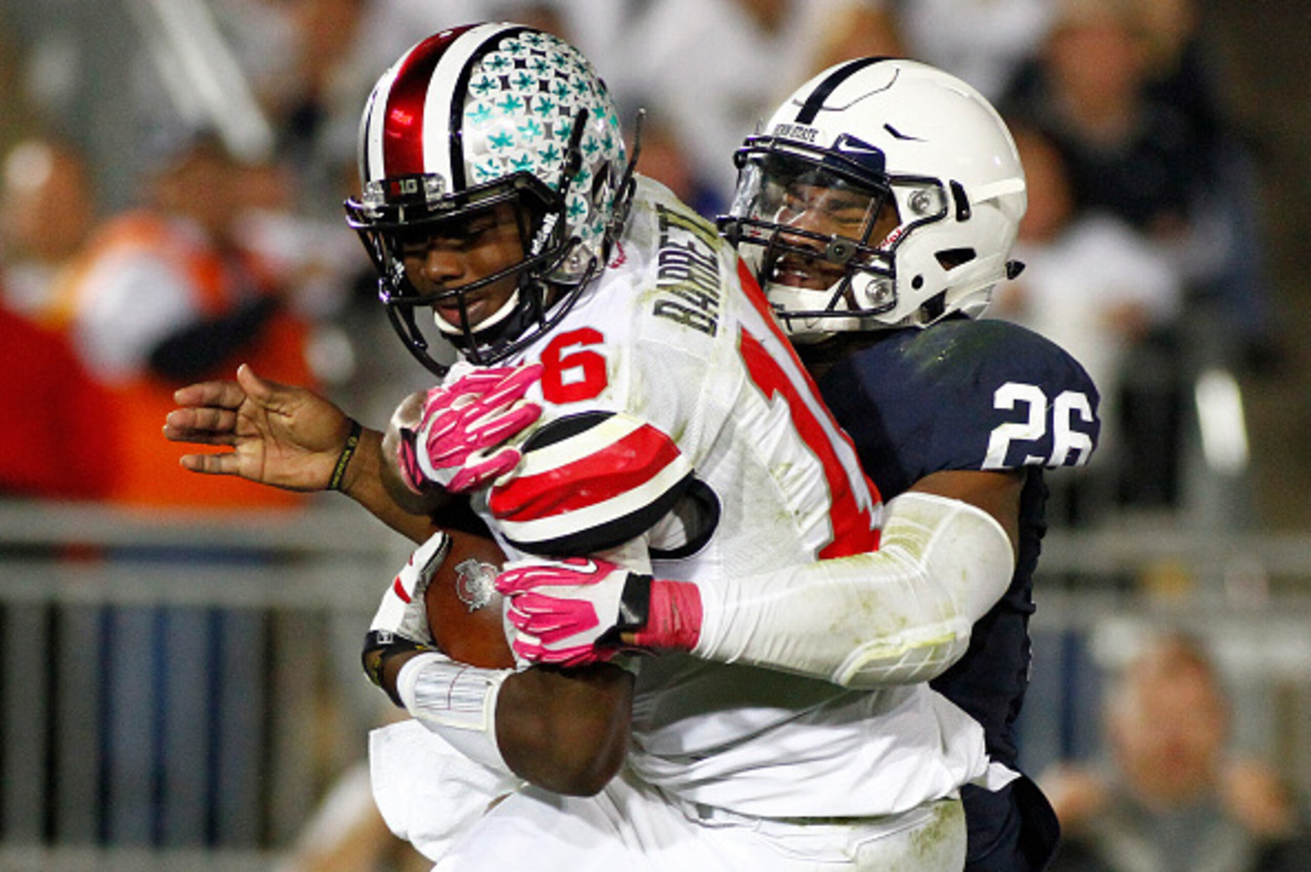STATE COLLEGE, PA - OCTOBER 25:  Brandon Bell #26 of the Penn State Nittany Lions sacks J.T. Barrett #16 of the Ohio State Buckeyes in the second half during the game on October 25, 2014 at Beaver Stadium in State College, Pennsylvania.  (Photo by Justin 