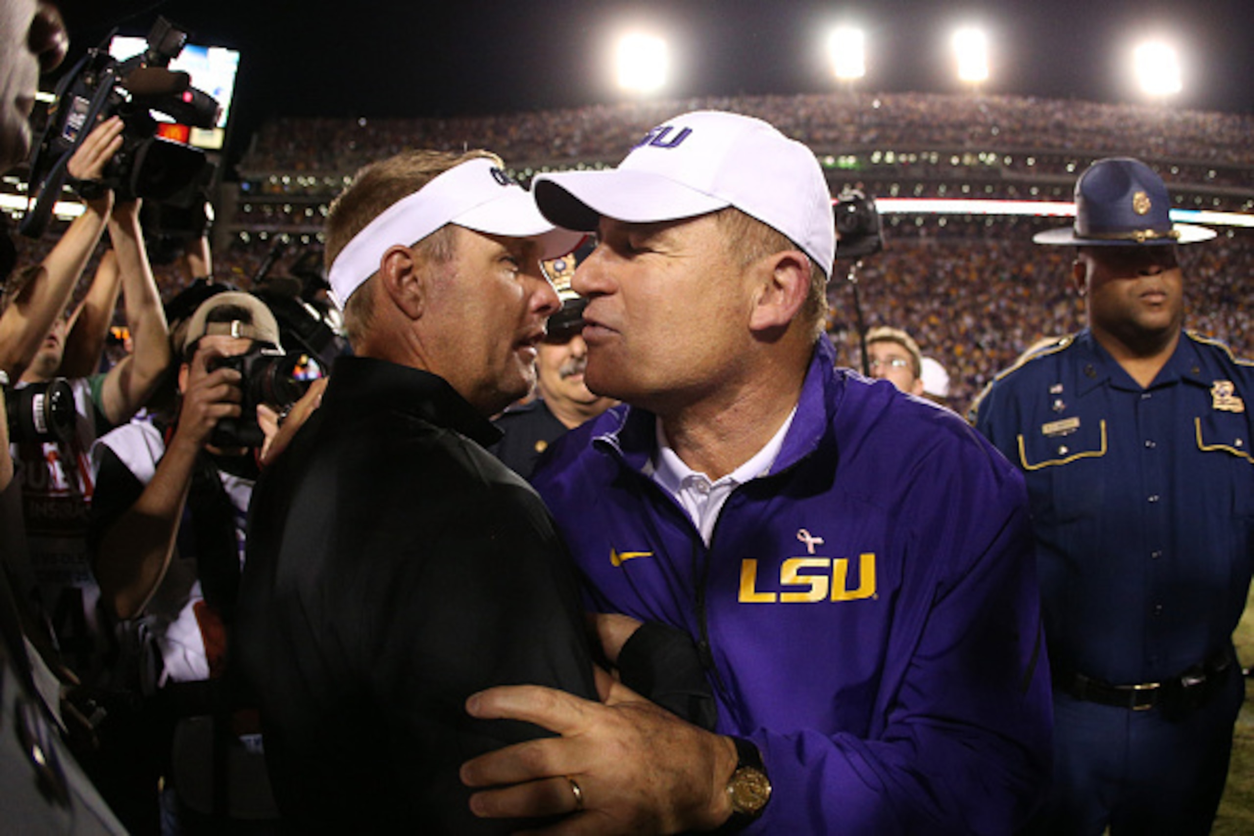 BATON ROUGE, LA - OCTOBER 25: Head coach Hugh Freeze of the Mississippi Rebels talks with head coach Les Miles of the LSU Tigers at Tiger Stadium on October 25, 2014 in Baton Rouge, Louisiana. The Tigers defeated the Rebels 10-7. (Photo by Chris Graythe BATON ROUGE, LA - OCTOBER 25: Head coach Hugh Freeze of the Mississippi Rebels talks with head coach Les Miles of the LSU Tigers at Tiger Stadium on October 25, 2014 in Baton Rouge, Louisiana. The Tigers defeated the Rebels 10-7. (Photo by Chris Graythe