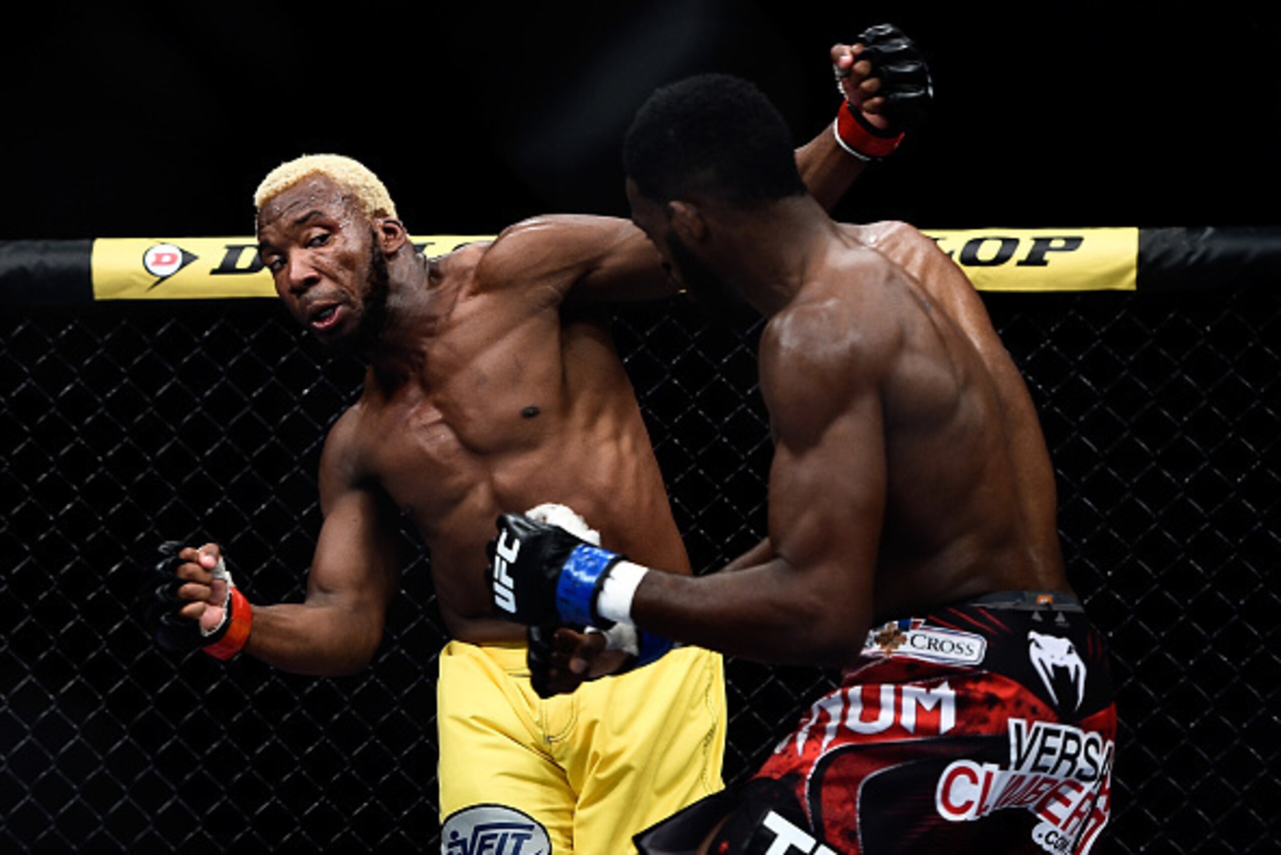 RIO DE JANEIRO, BRAZIL - OCTOBER 25:  Wiliam 'Patolino' Macario of Brazil punches Neil Magny of the United States  in their welterweight bout during the UFC 179 event  at Maracanazinho on October 25, 2014 in Rio de Janeiro, Brazil.  (Photo by Buda Mendes/