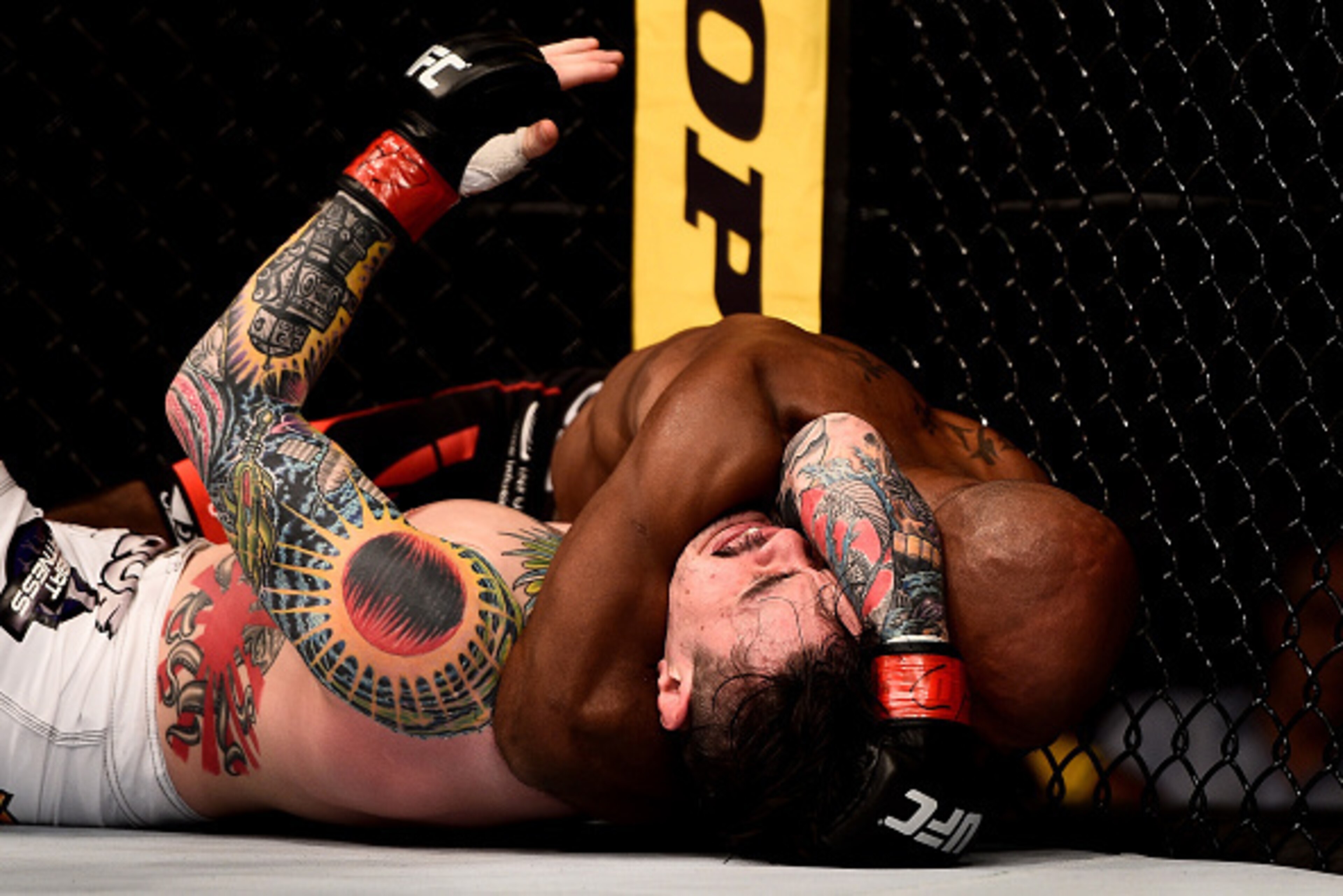 RIO DE JANEIRO, BRAZIL - OCTOBER 25:  Wilson Reis of Brazil secures a submission against Scott Jorgensen in their flyweight bout during the UFC 179 event at Maracanazinho on October 25, 2014 in Rio de Janeiro, Brazil.  (Photo by Buda Mendes/Getty Images)