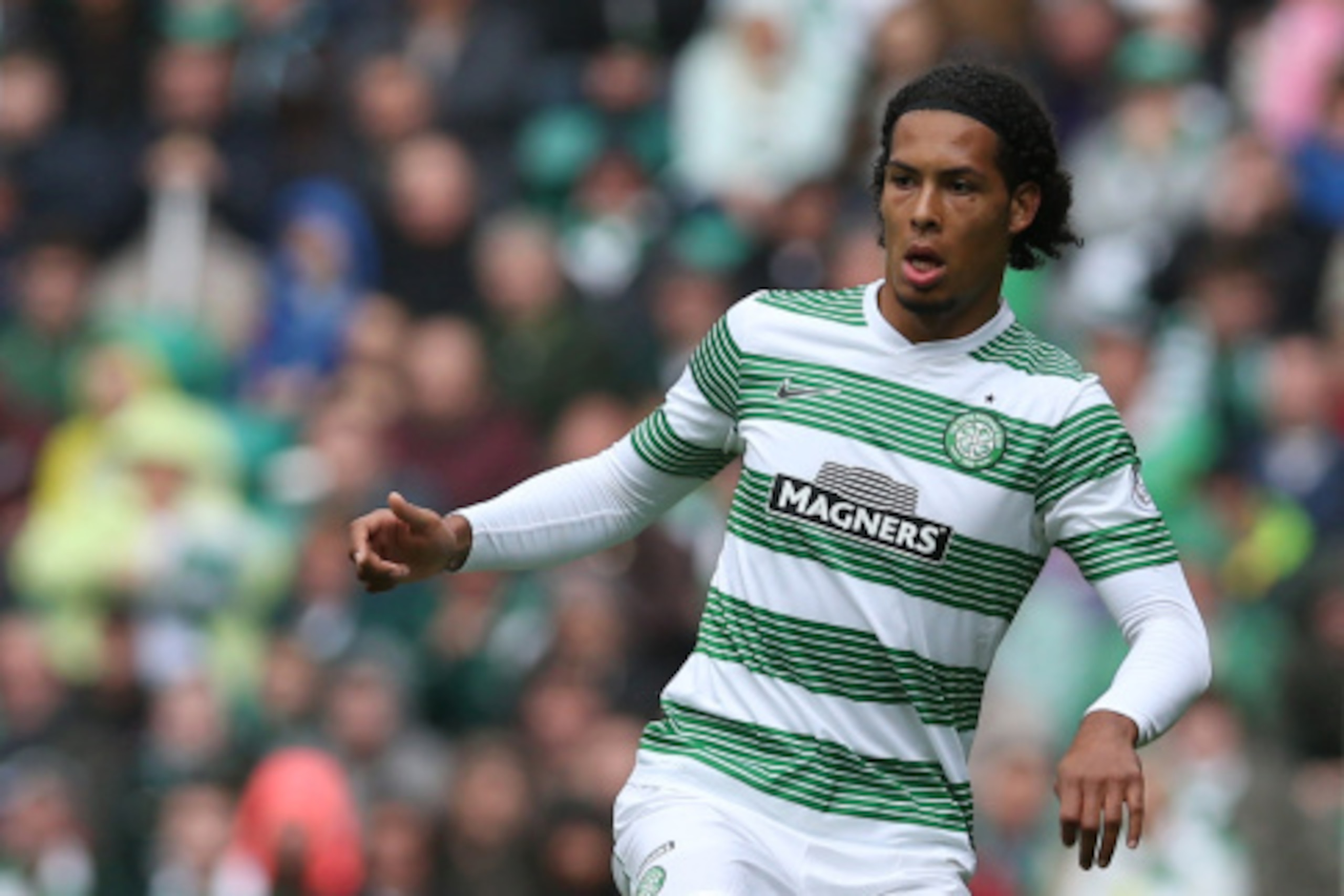 GLASGOW, SCOTLAND - AUGUST 16:  Virgil Van Dijk of Celticcontrols the ball during the Scottish Premiership League Match between Celtic and Dundee United, at Celtic Park on August 16, 2014 Glasgow, Scotland. (Photo by Ian MacNicol/Getty Images)