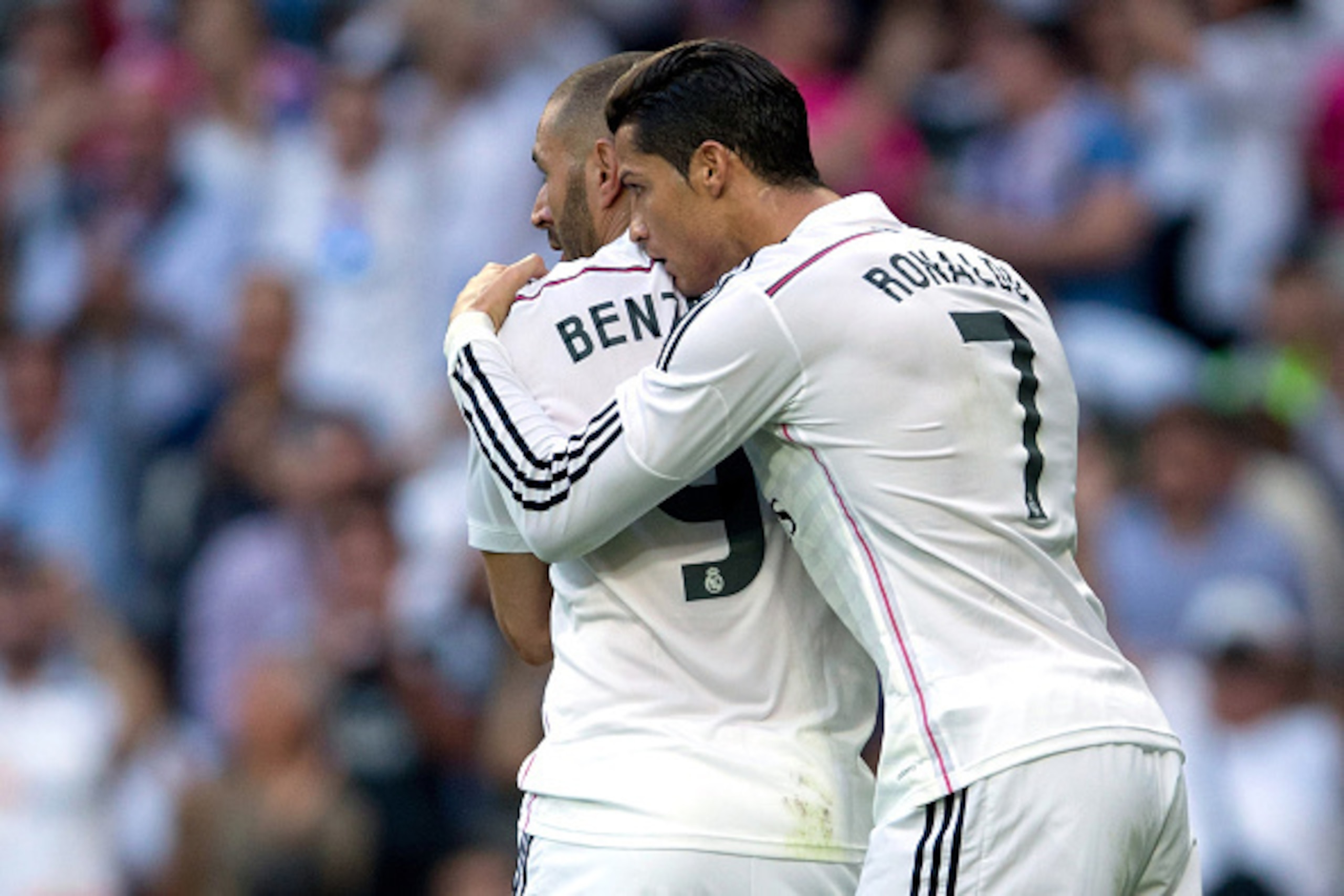 MADRID, SPAIN - OCTOBER 25:  Cristiano Ronaldo (R) of Real Madrid CF celebrates scoring their opening goal with teammate Karim Benzema (L) during the La Liga match between Real Madrid CF and FC Barcelona at Estadio Santiago Bernabeu on October 25, 2014 in
