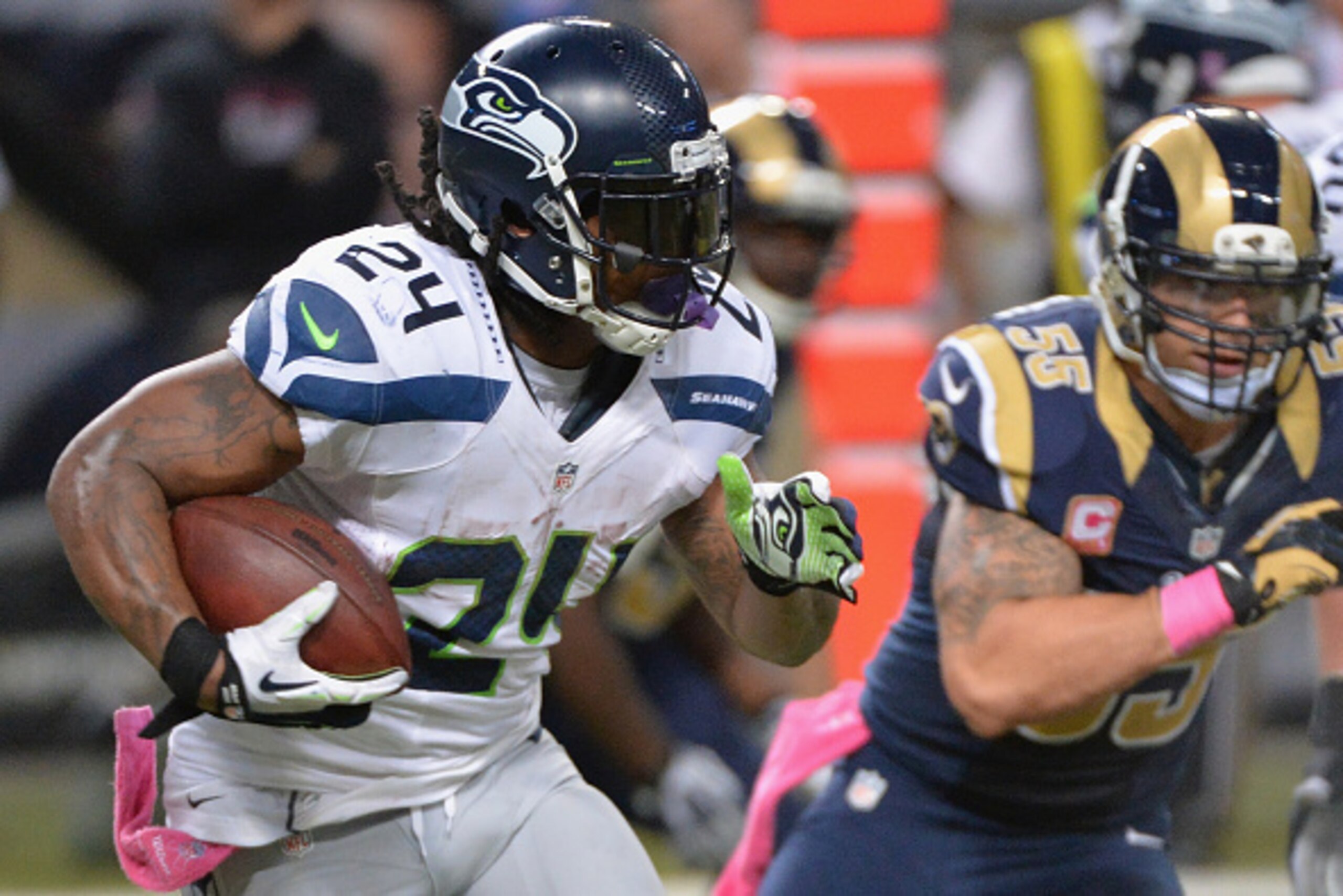 ST. LOUIS, MO - OCTOBER 19: Marshawn Lynch #24 of the Seattle Seahawks rushes against the St. Louis Rams in the third quarter at the Edward Jones Dome on October 19,  2014 in St. Louis, Missouri. The Rams defeated the Seahawks 28-26.  (Photo by Michael B.